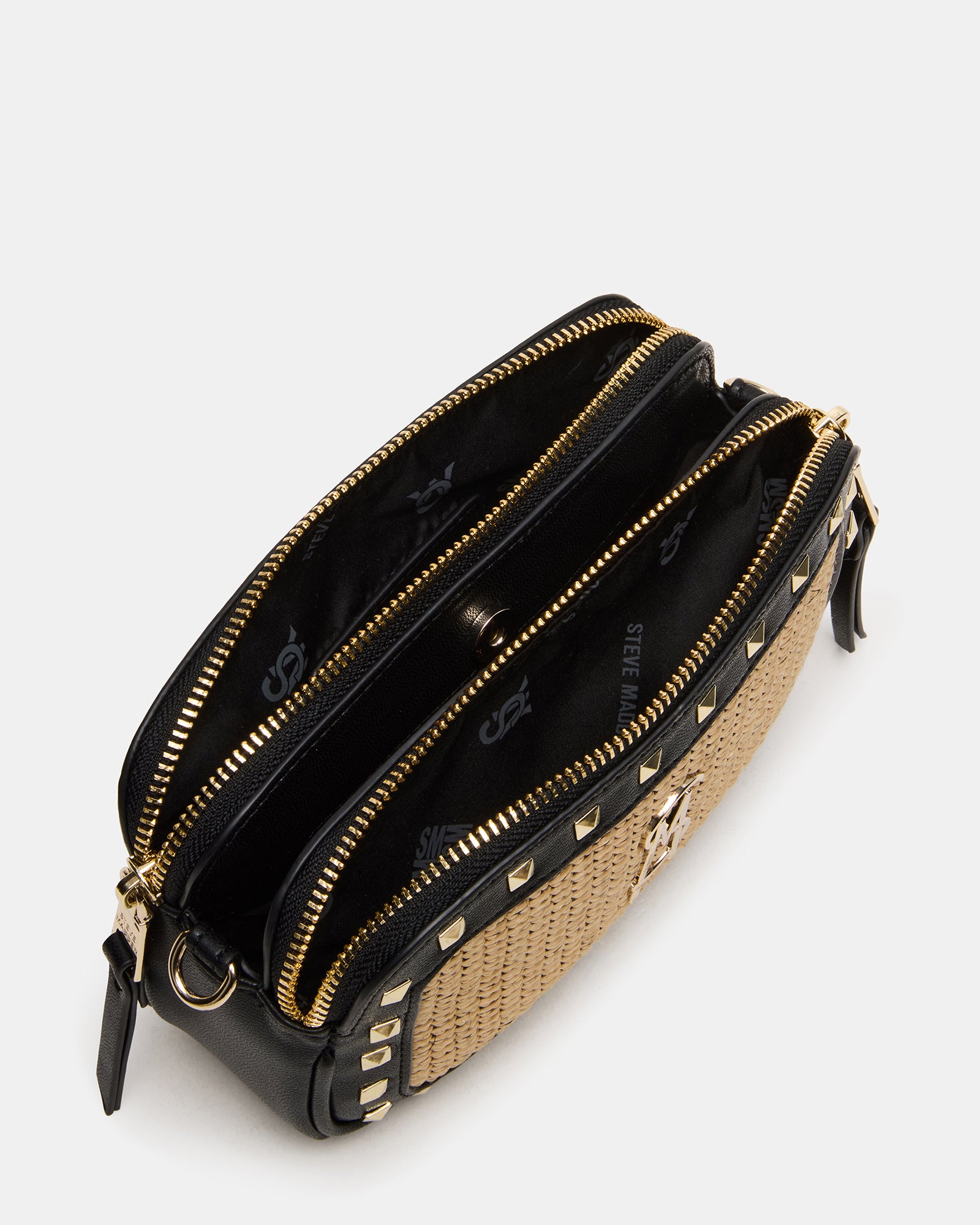 Close-up of top-zipper and textured straw details on the crossbody bag.