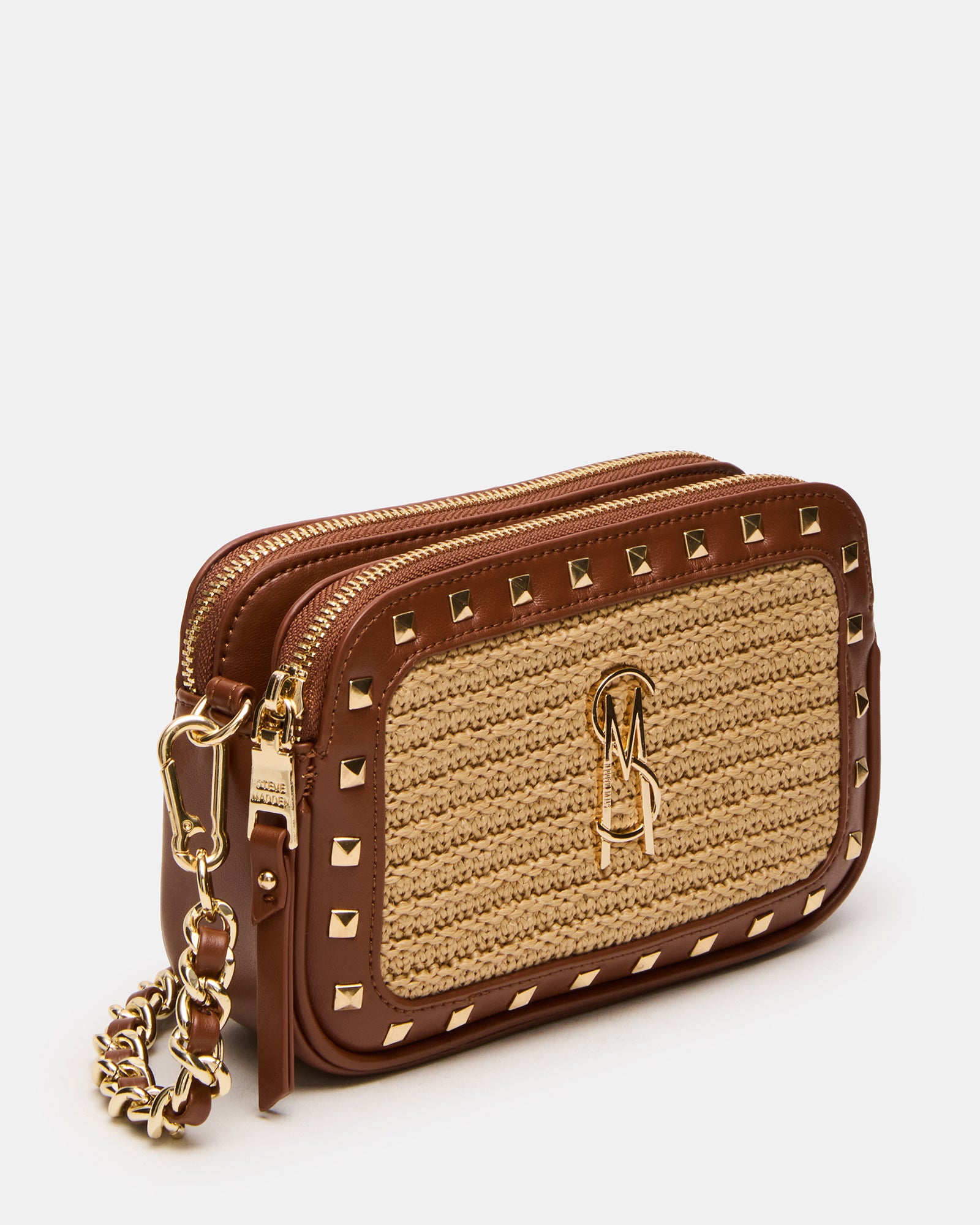 Close-up of Daisys straw crossbody bag with pyramid studs and chain strap