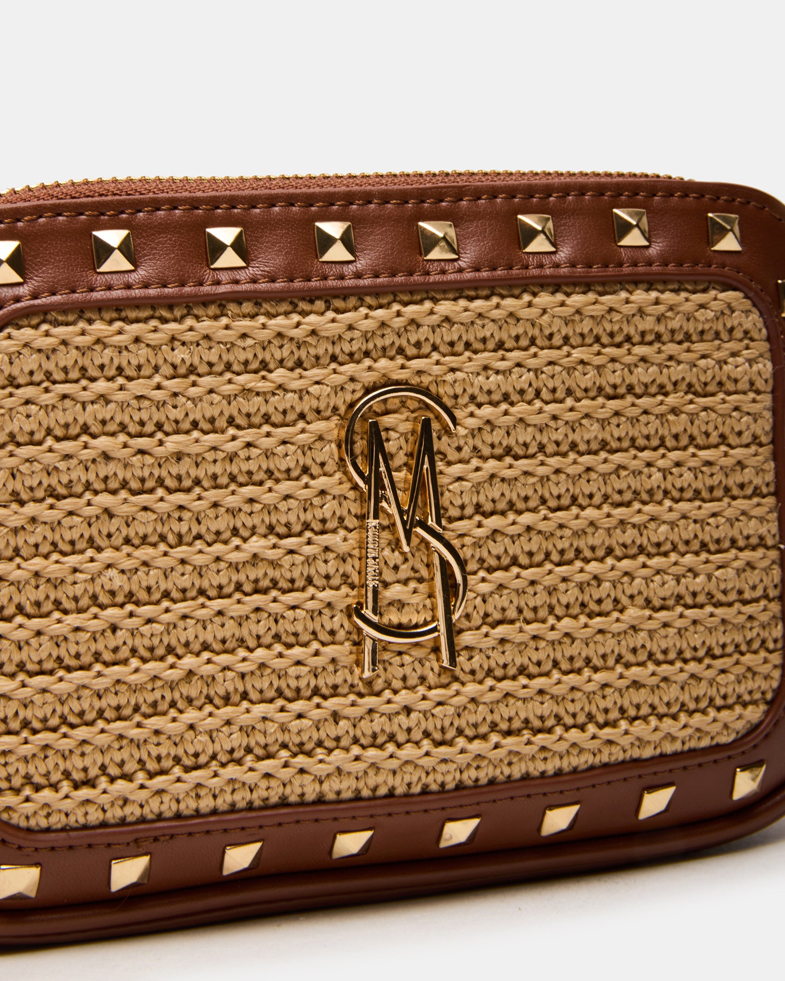 Top view of the straw tote bag showing zipper closure and gussets