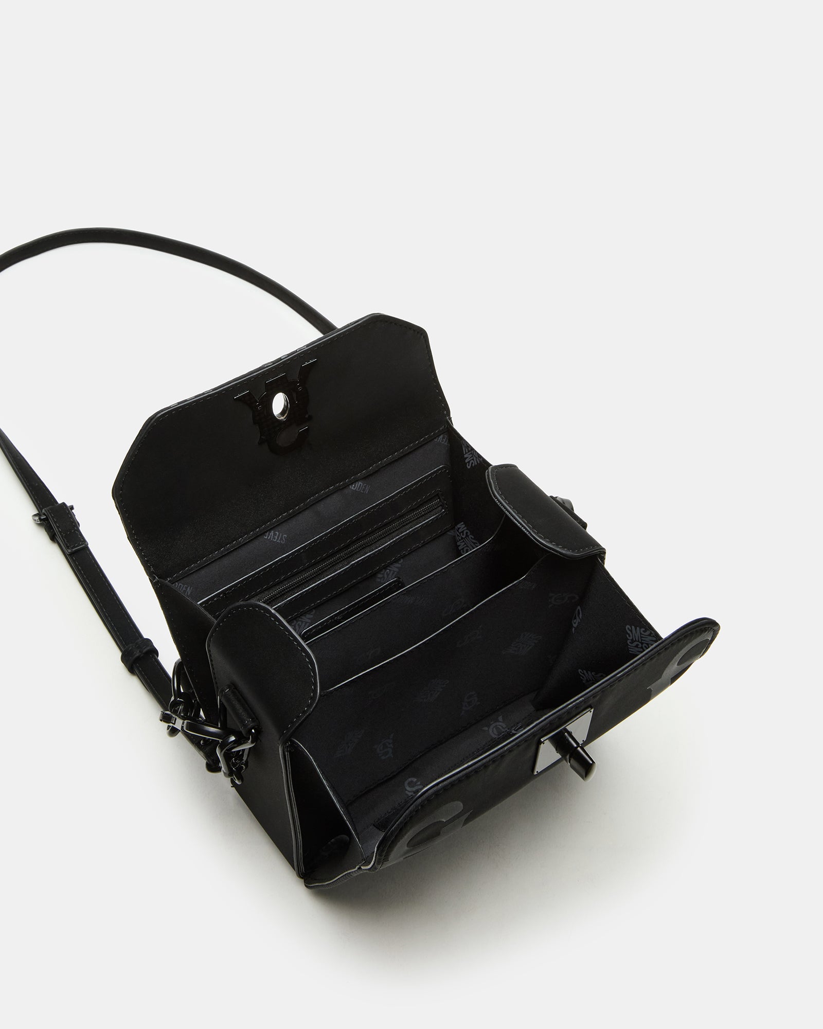 Front angle of mini top handle bag shown against a NYC skyline backdrop.