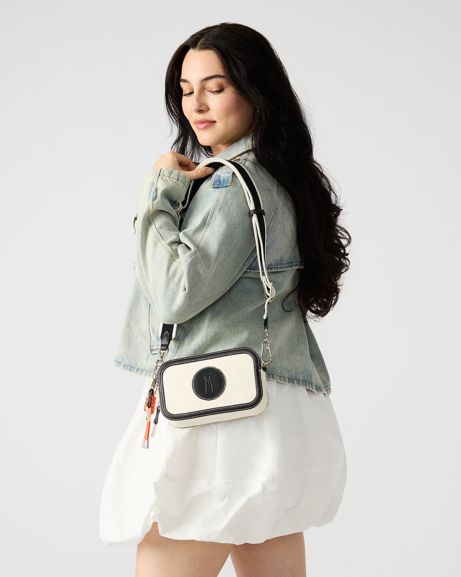 Interior view of the structured crossbody bag with spacious pockets.