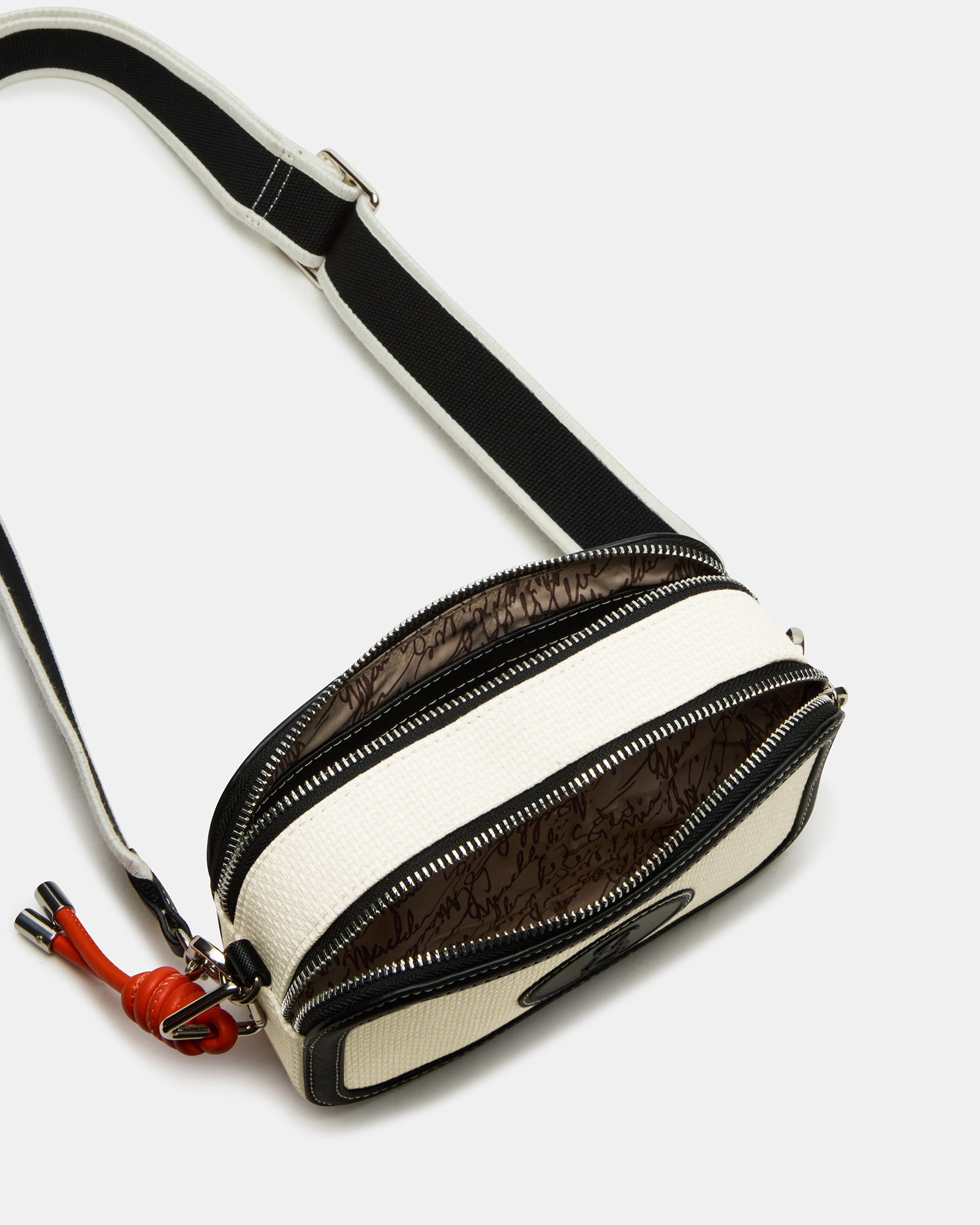 Interior view of the structured crossbody bag with spacious pockets.