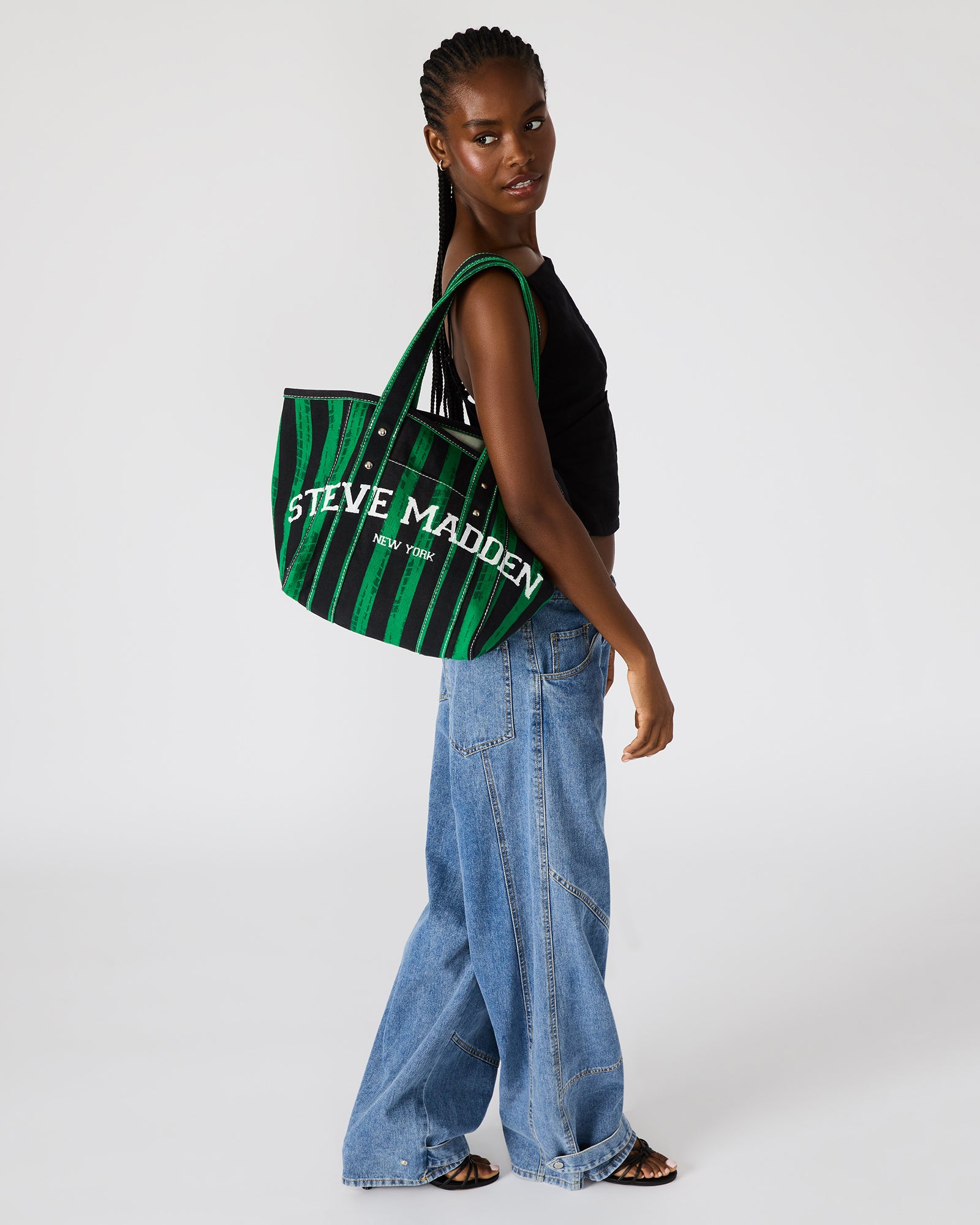 Side angle of the Devyn bag highlighting the stud rivet details and contrasting stitching.