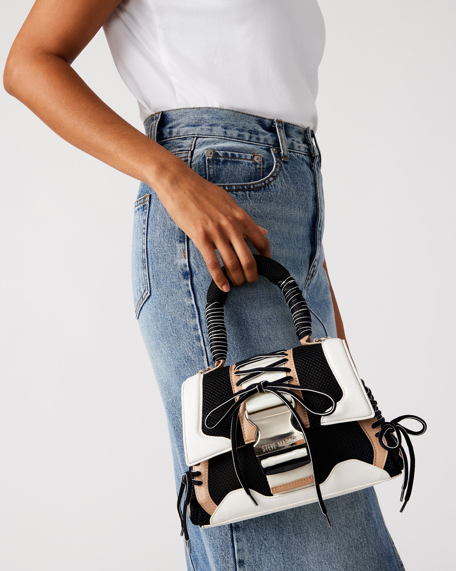 Side angle showing sneaker-inspired lacing on the Diego bag