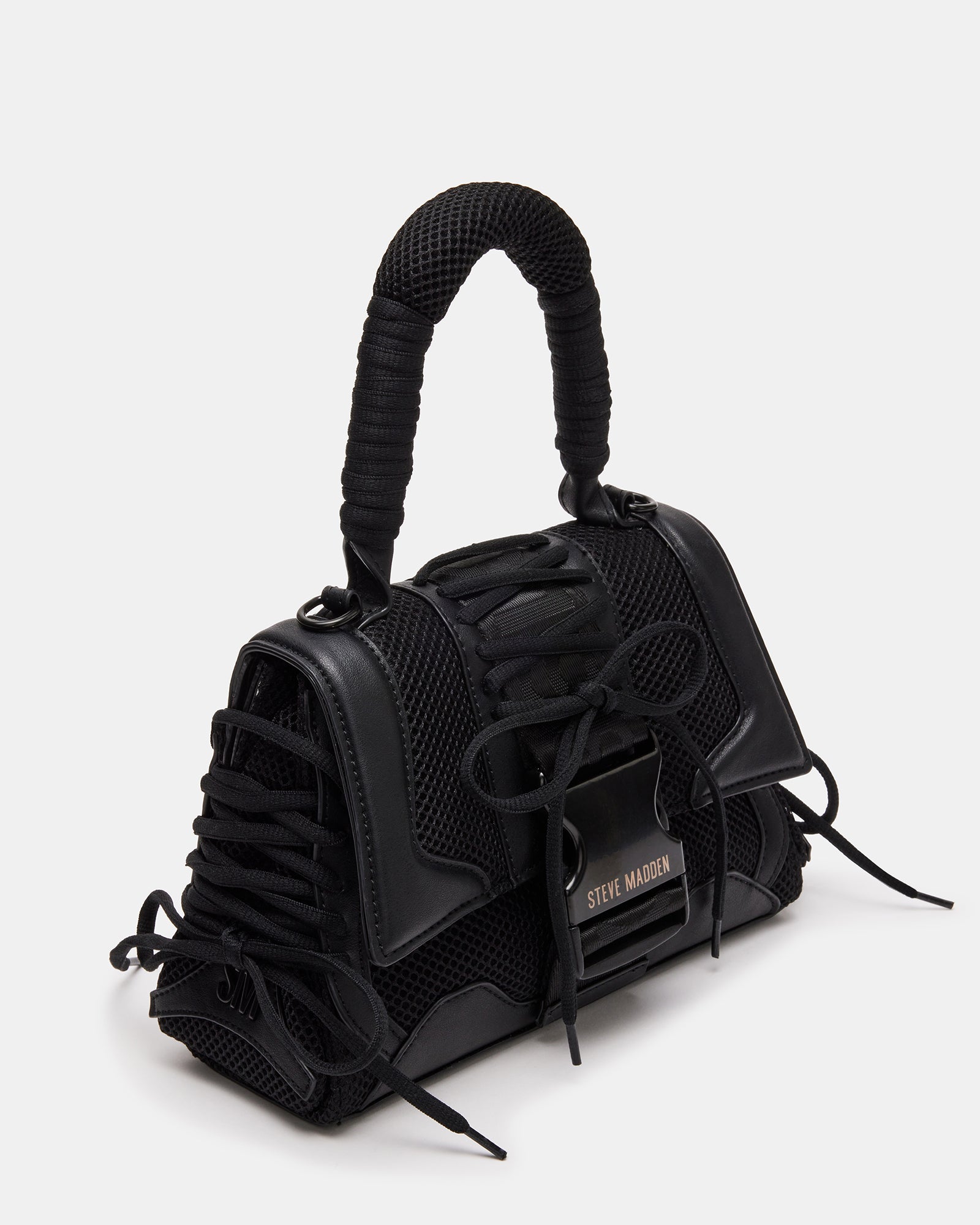 Close-up of mesh overlay and cushion handle detail of the structured handbag
