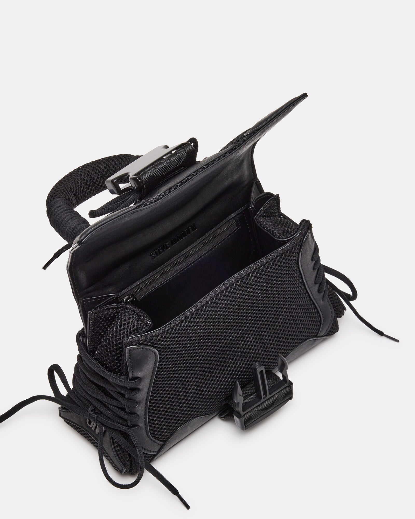 Front view of black trapezoid handbag with chunky buckle and sneaker laces