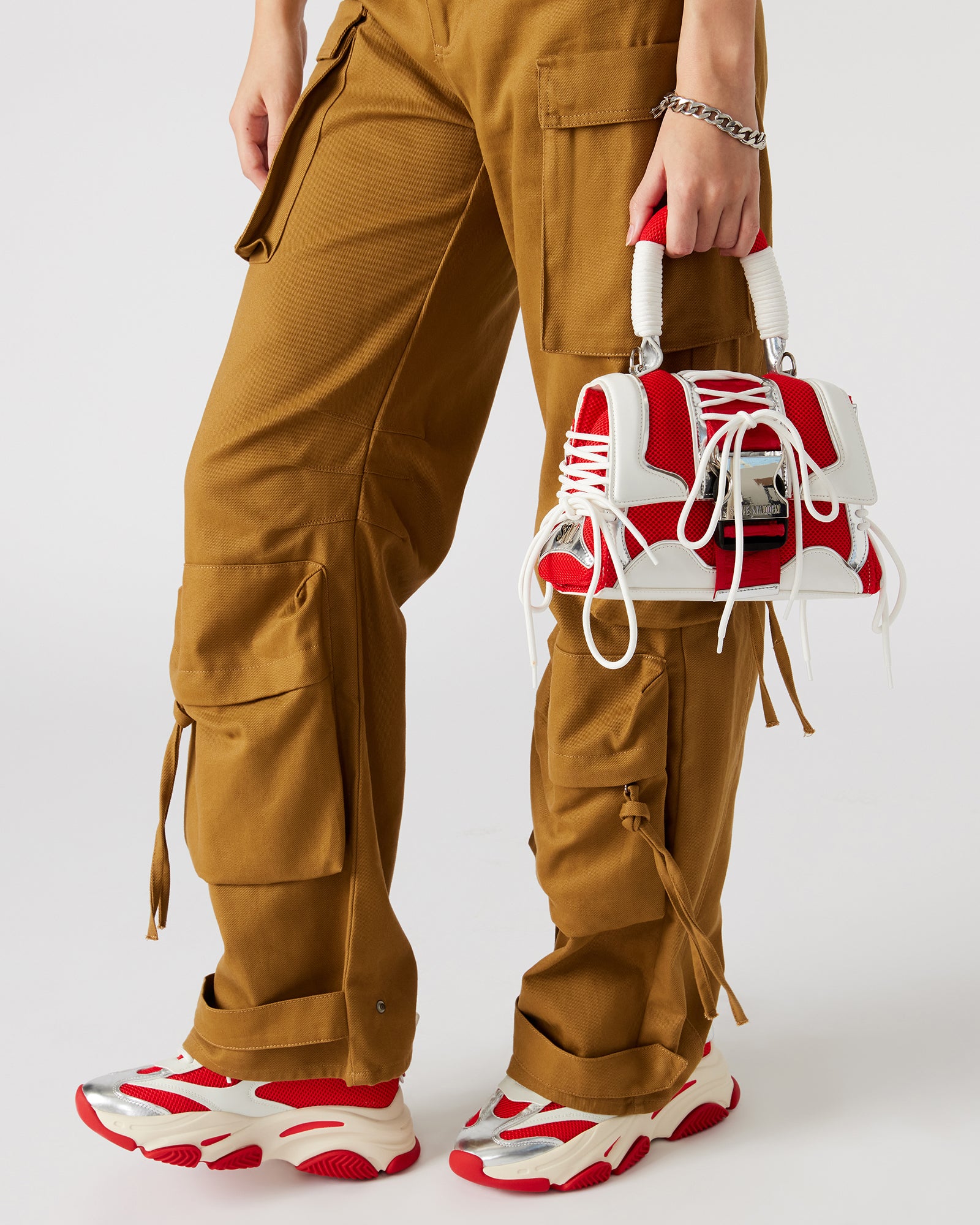 Side view highlighting the sneaker lace-up detail on the Diego structured handbag.
