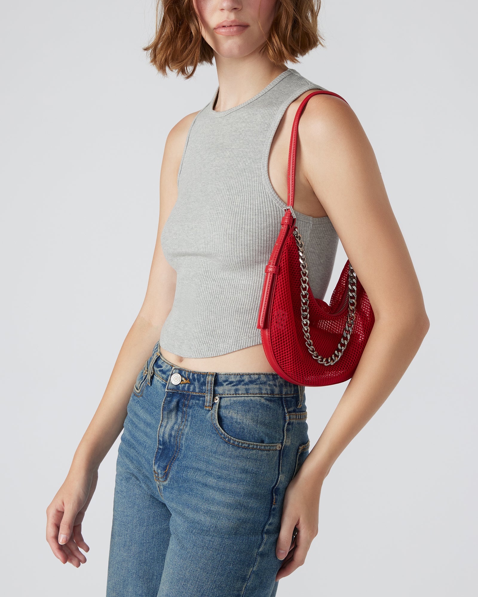 Close-up of the red mesh bag showcasing the removable inner pouch