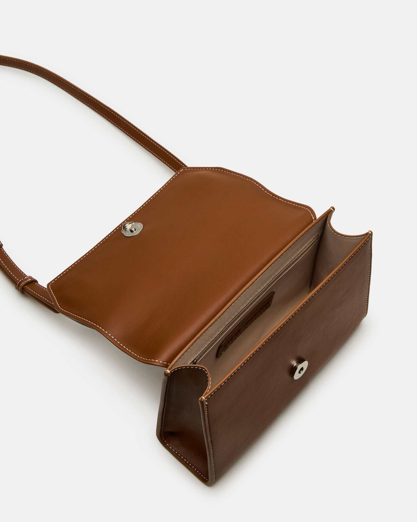 Side profile of structured bag with adjustable strap visible