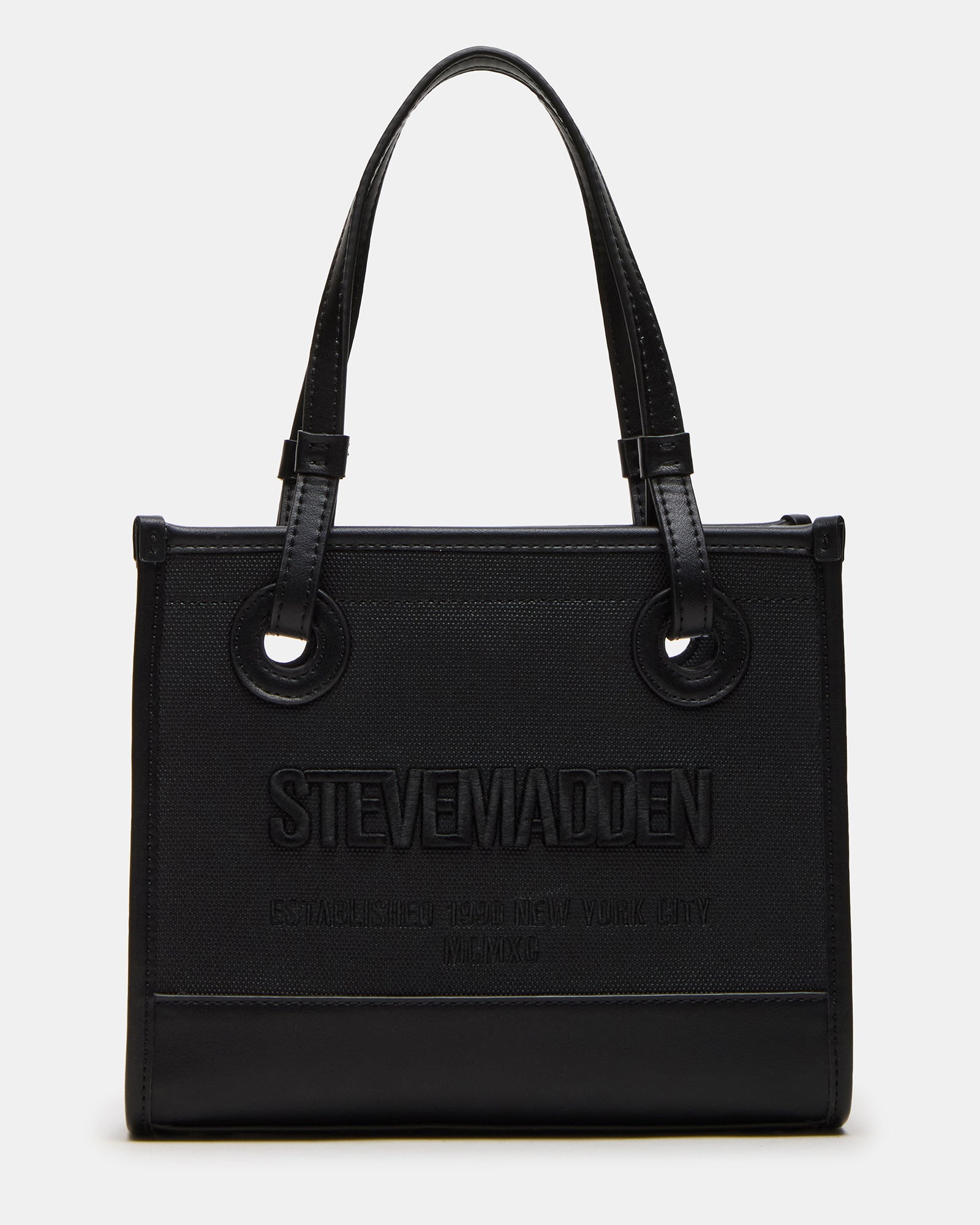 ERIS black crossbody bag being worn with jeans and white blouse