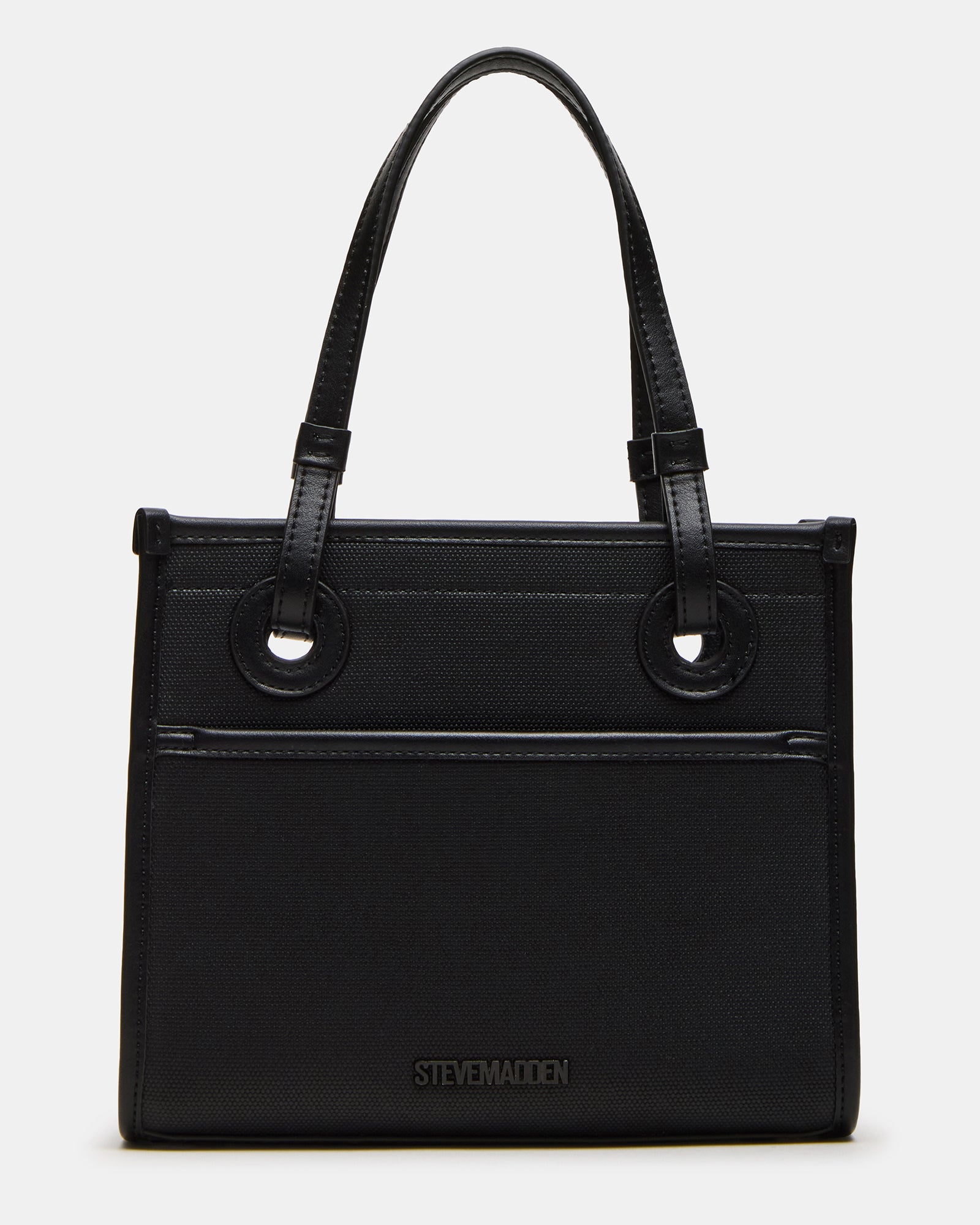 Bag shown with detachable strap on a wooden table