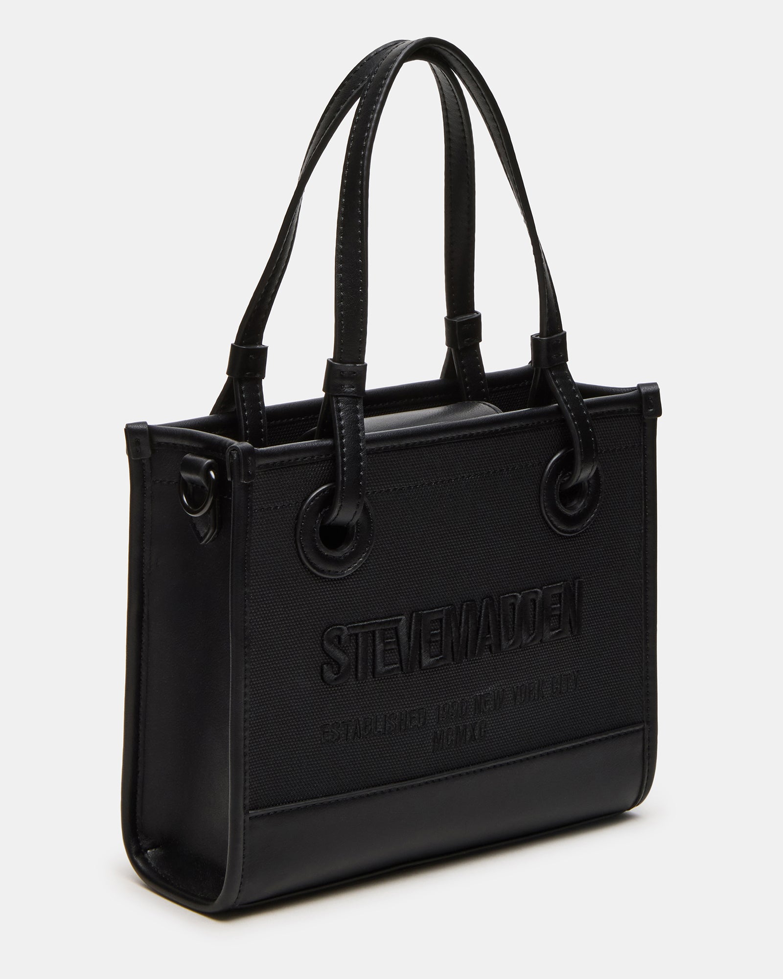 ERIS black crossbody bag being worn with jeans and white blouse