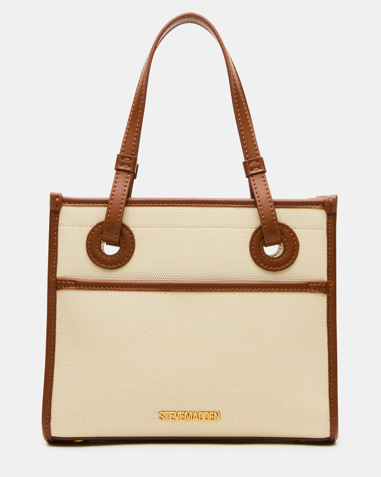 Woman carrying ERIS crossbody bag in urban setting