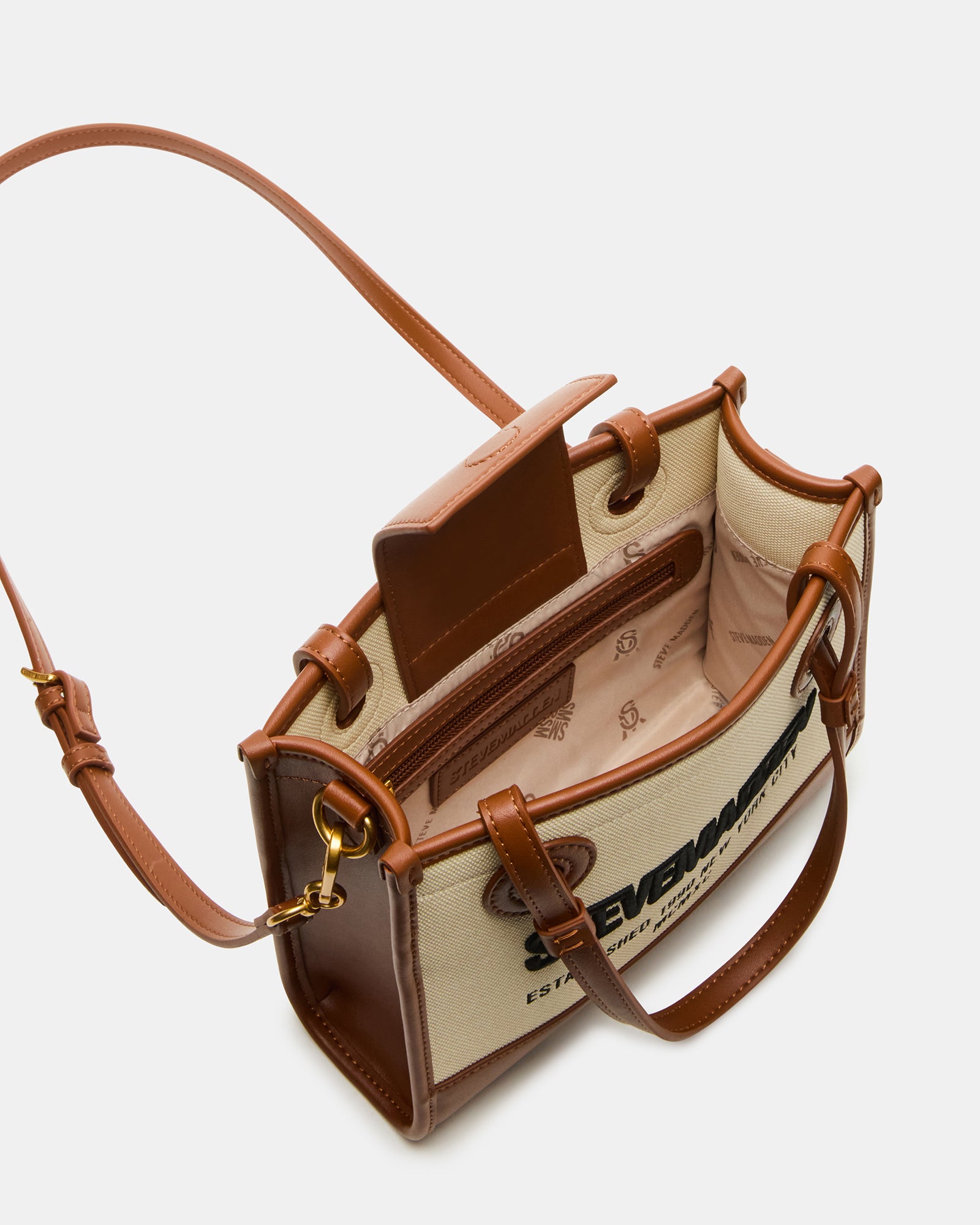 Woman carrying ERIS crossbody bag in urban setting