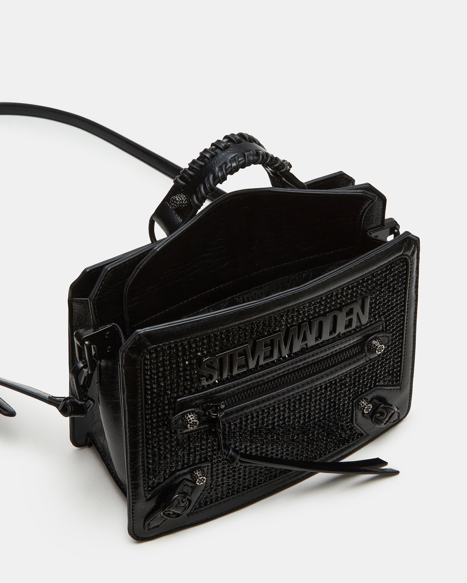 Side angle of the Evelyn Charms crossbody bag displaying its compartments.