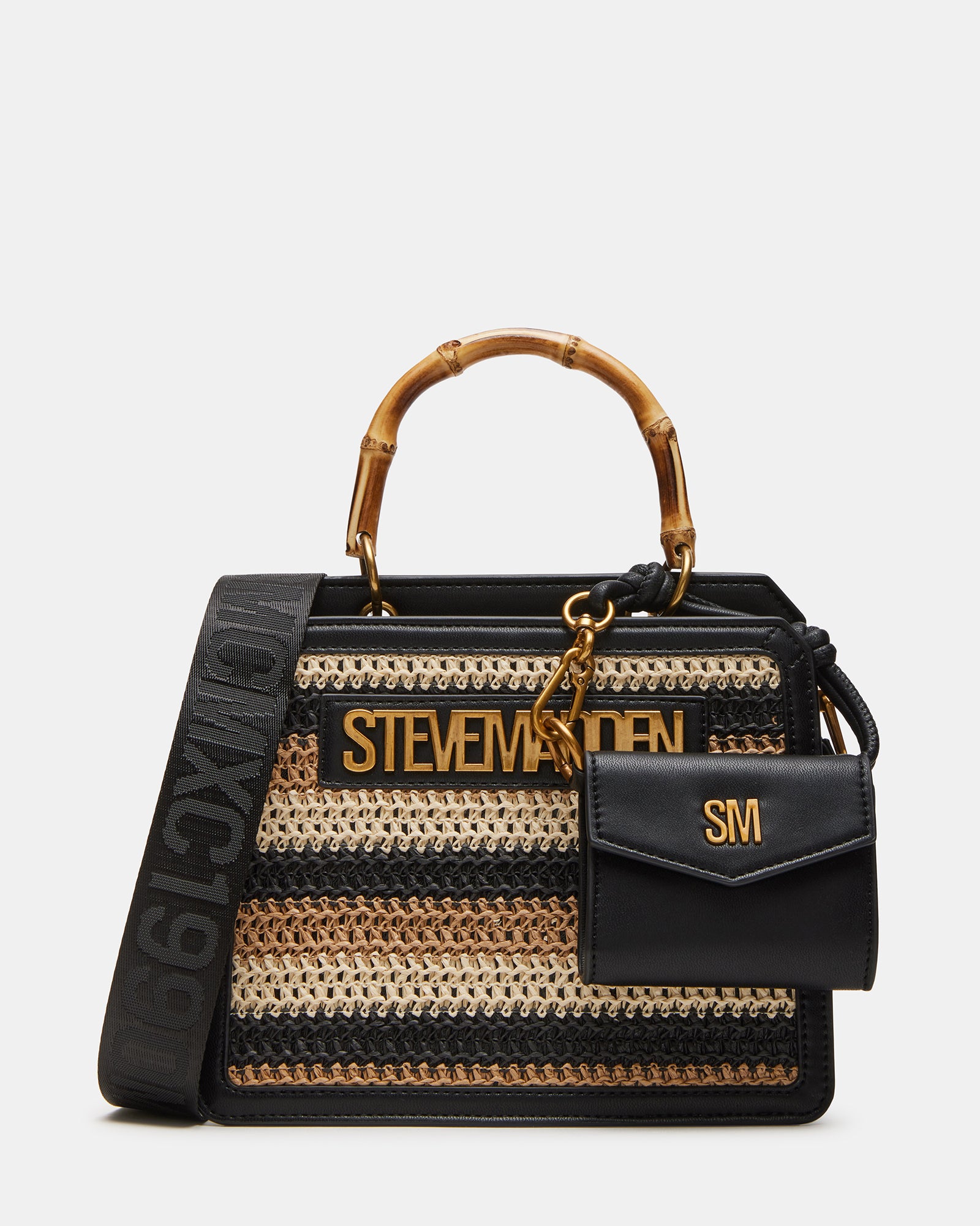 Evelyn straw handbag in black and tan, showcasing its structured design and charm.