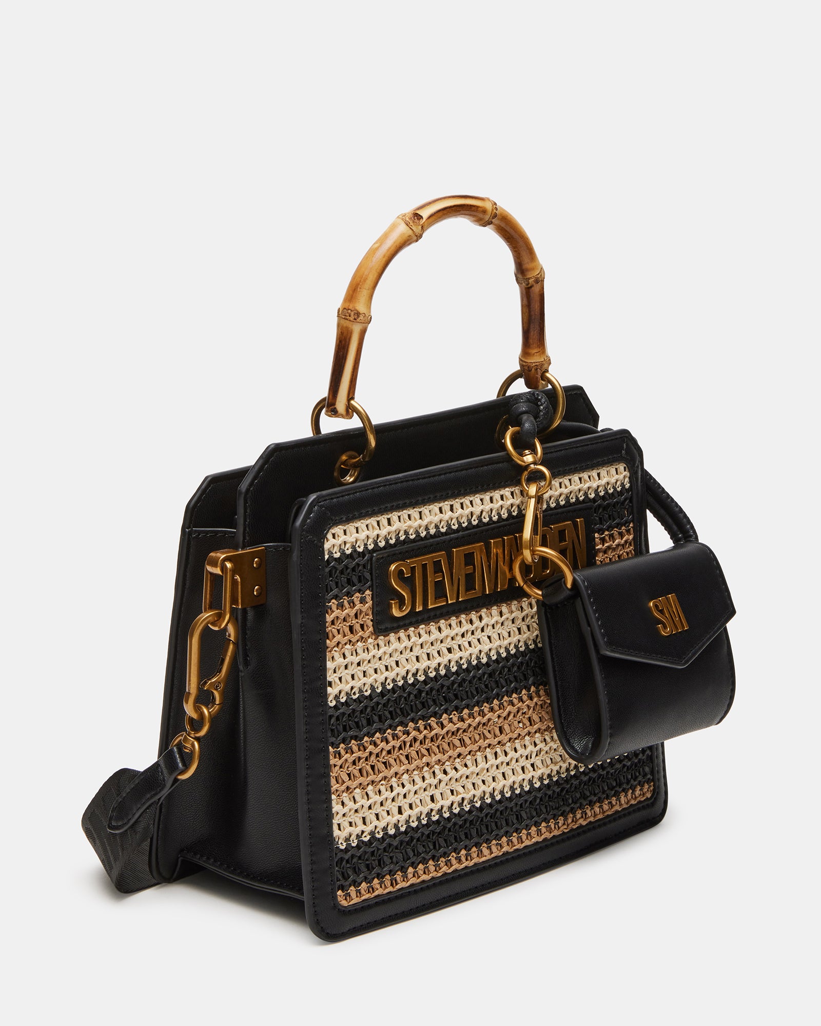 Evelyn straw handbag in black and tan, showcasing its structured design and charm.
