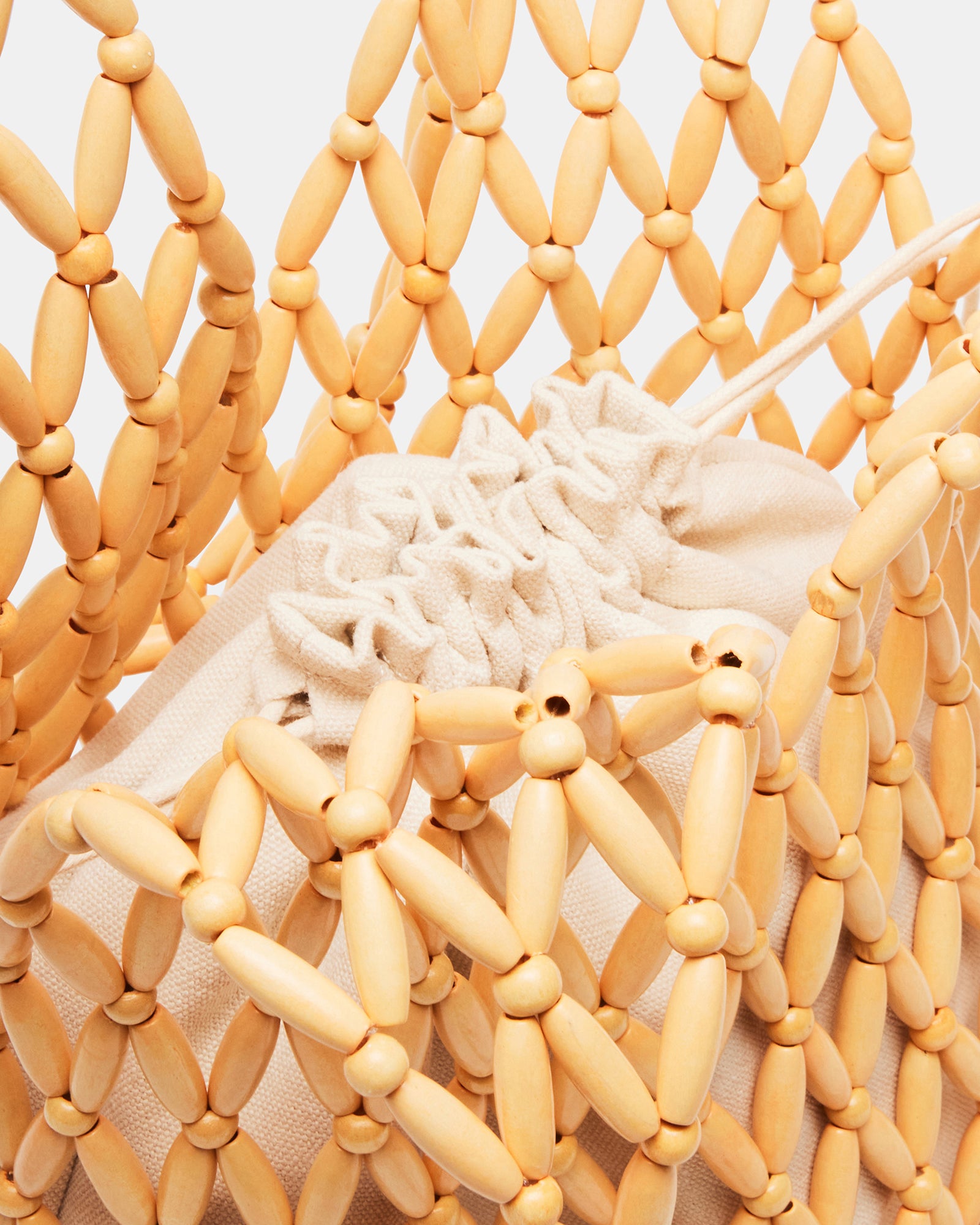 Close-up of chunky beads on the FIJI bag highlighting craftsmanship