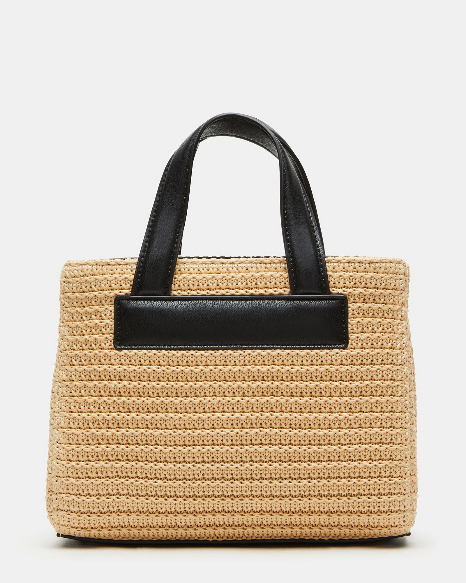 Styled image of the straw tote bag worn crossbody for hands-free convenience