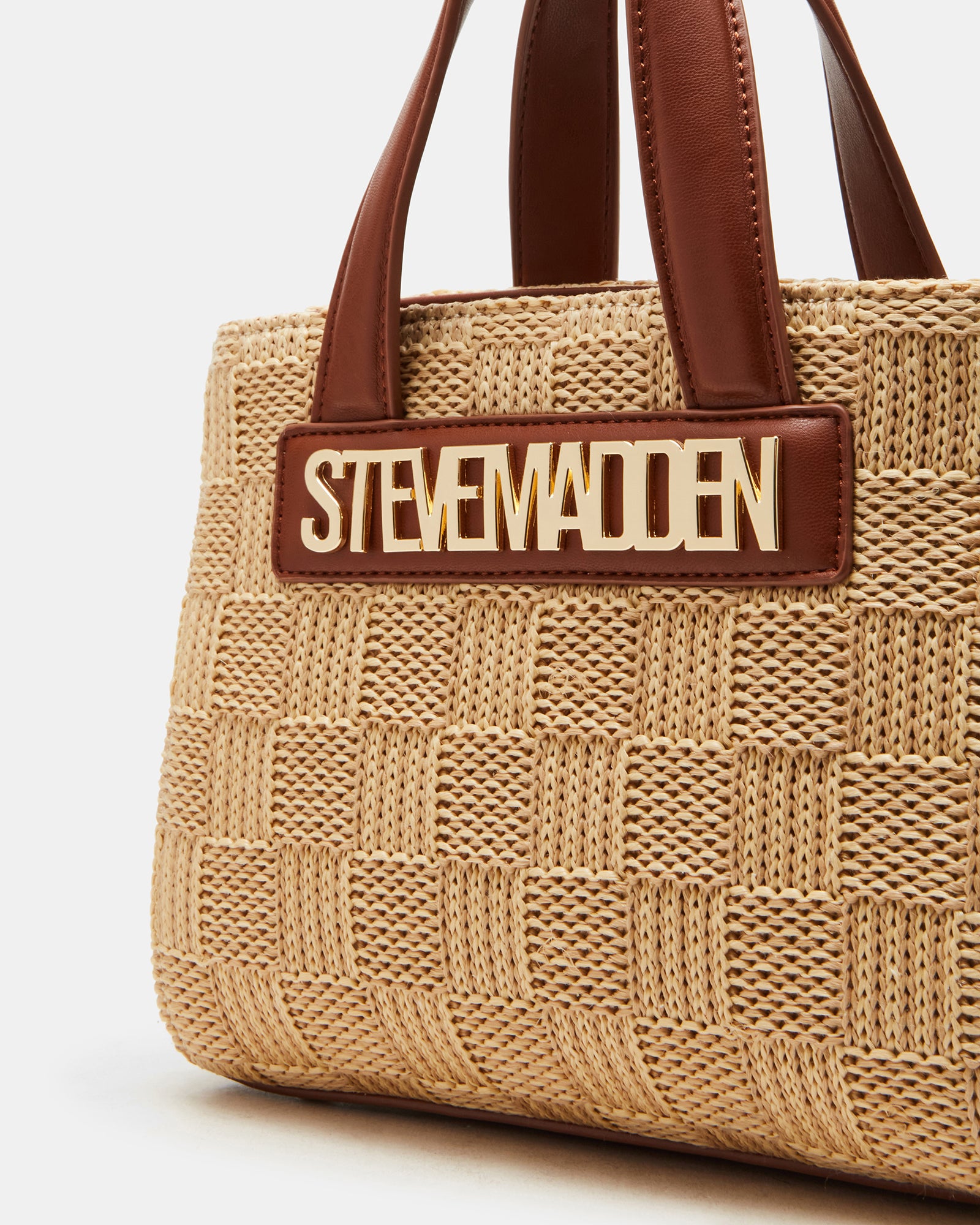 Styled on a model near a Florida boardwalk, showcasing beach tote versatility.