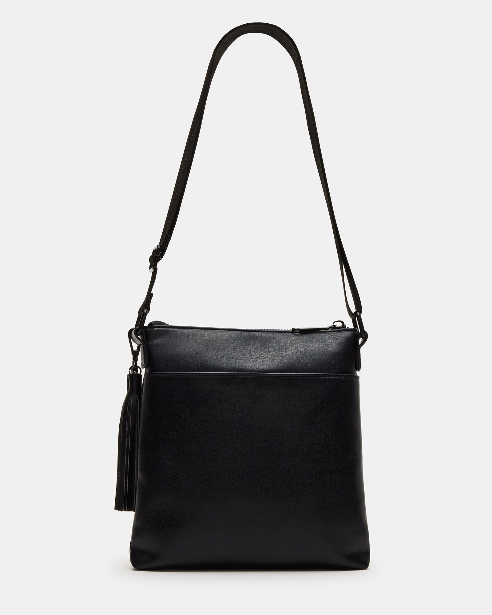 Model wearing the black crossbody bag during a city stroll