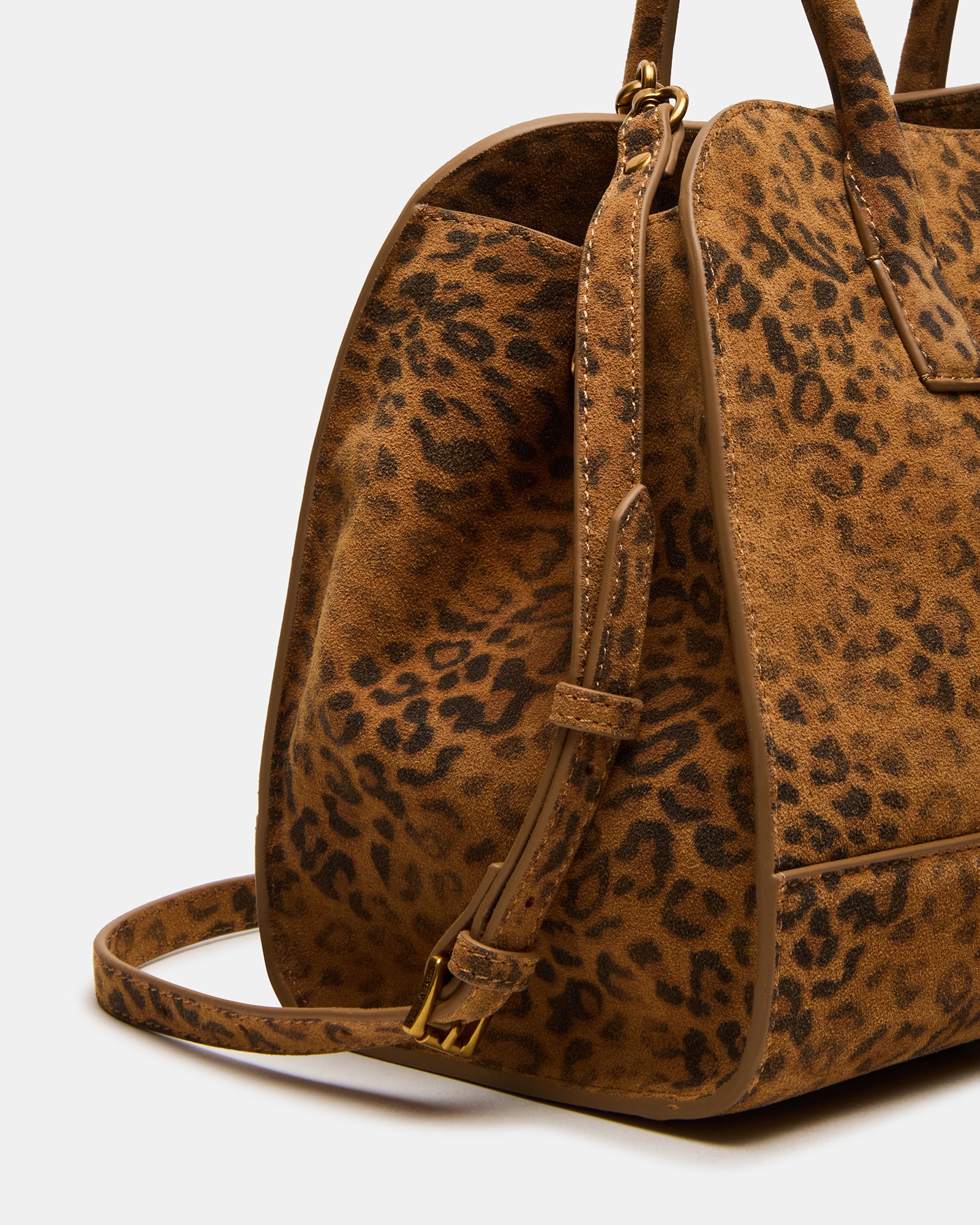 Spacious interior of the leopard print bag with essentials inside