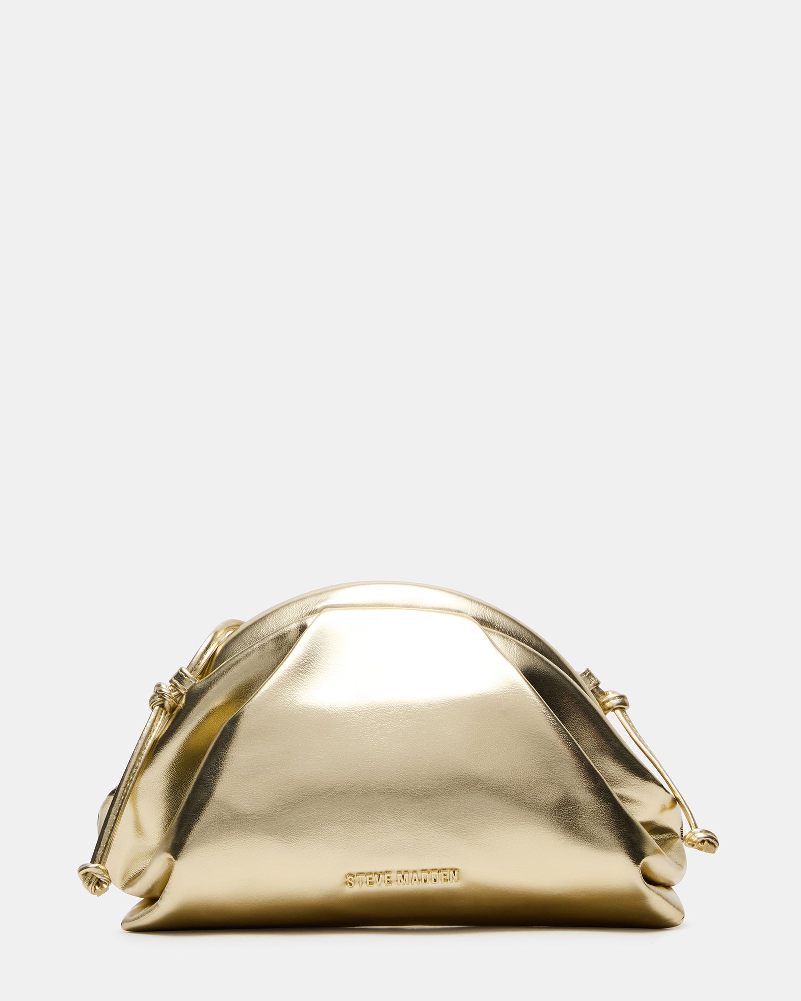 Bag styled as clutch with detached chain on café table