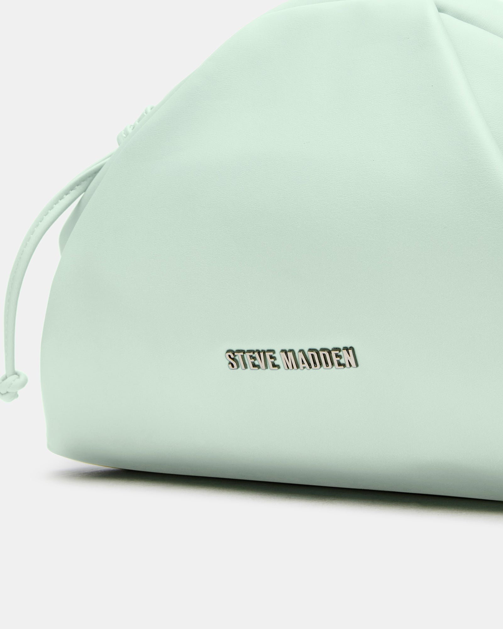 Side view of the pistachio handbag with chain strap