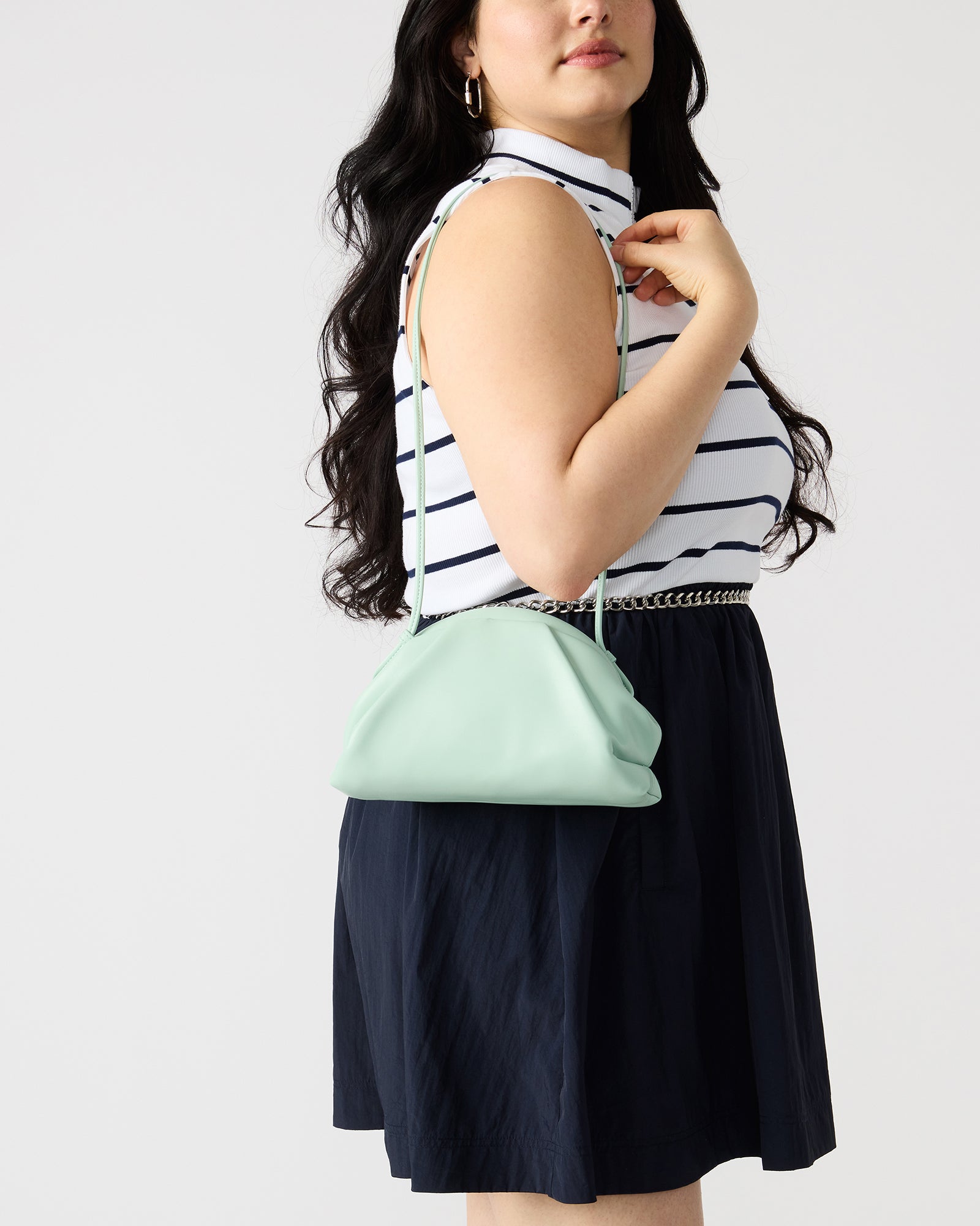 Front view of the pistachio handbag with crossbody strap