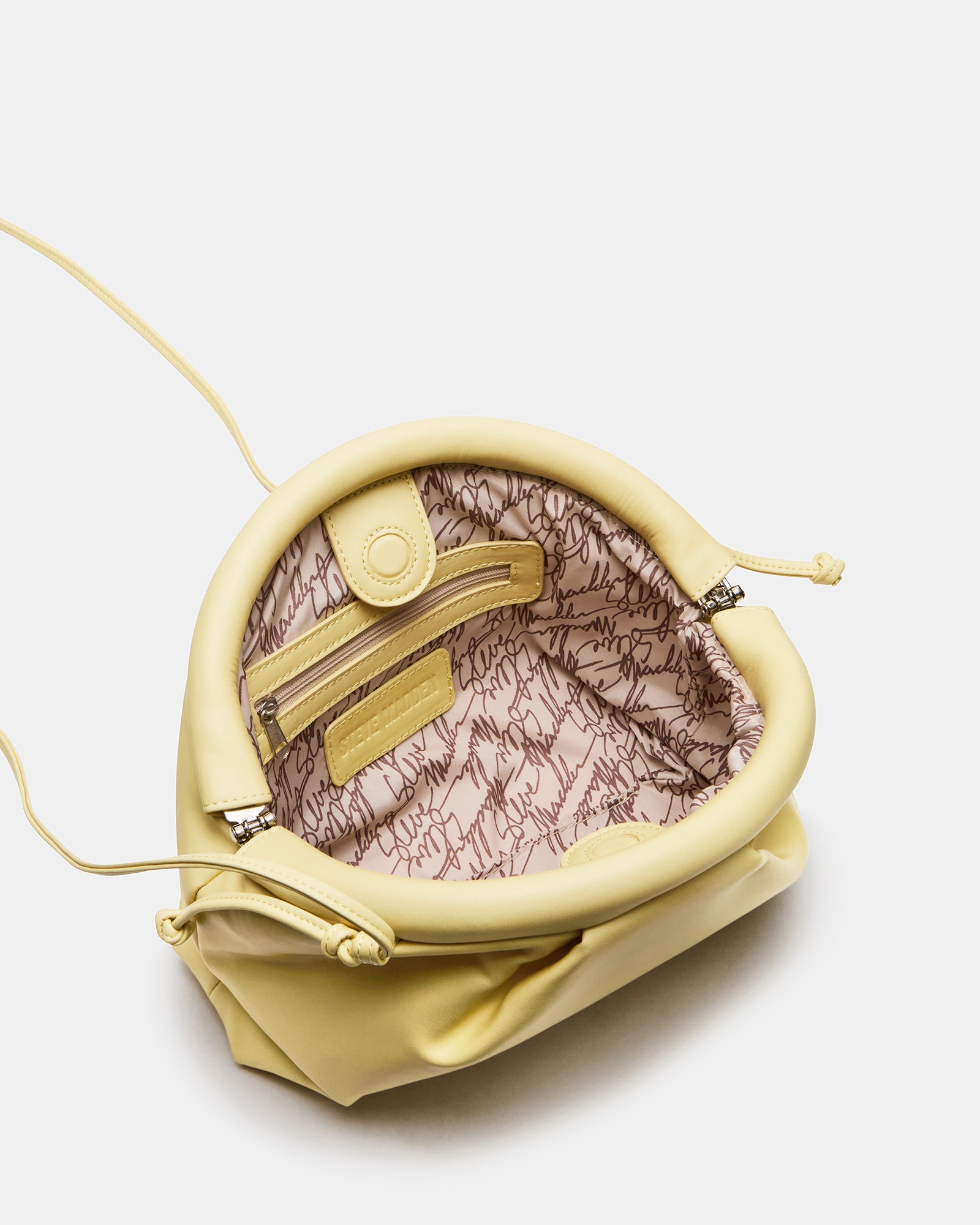 Interior view of Hailee bag showing slip pocket and vintage clamshell closure.