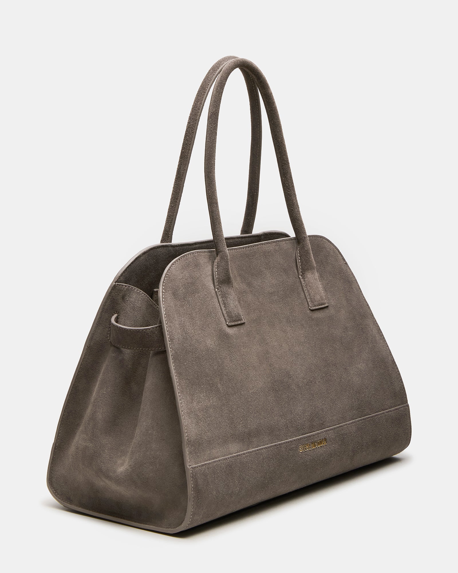 Close-up of the grey suede shoulder bag showing buckle detail and sleek design