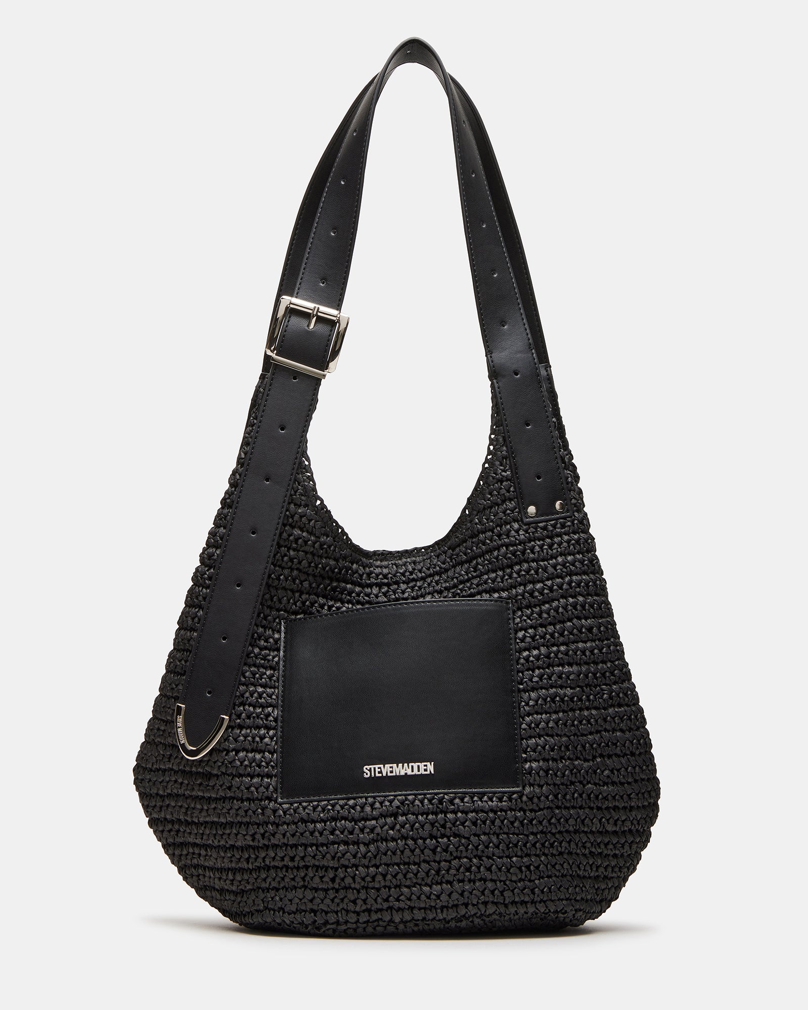 Close-up of the black leather shoulder bag showing straw panel and roller buckle strap detail
