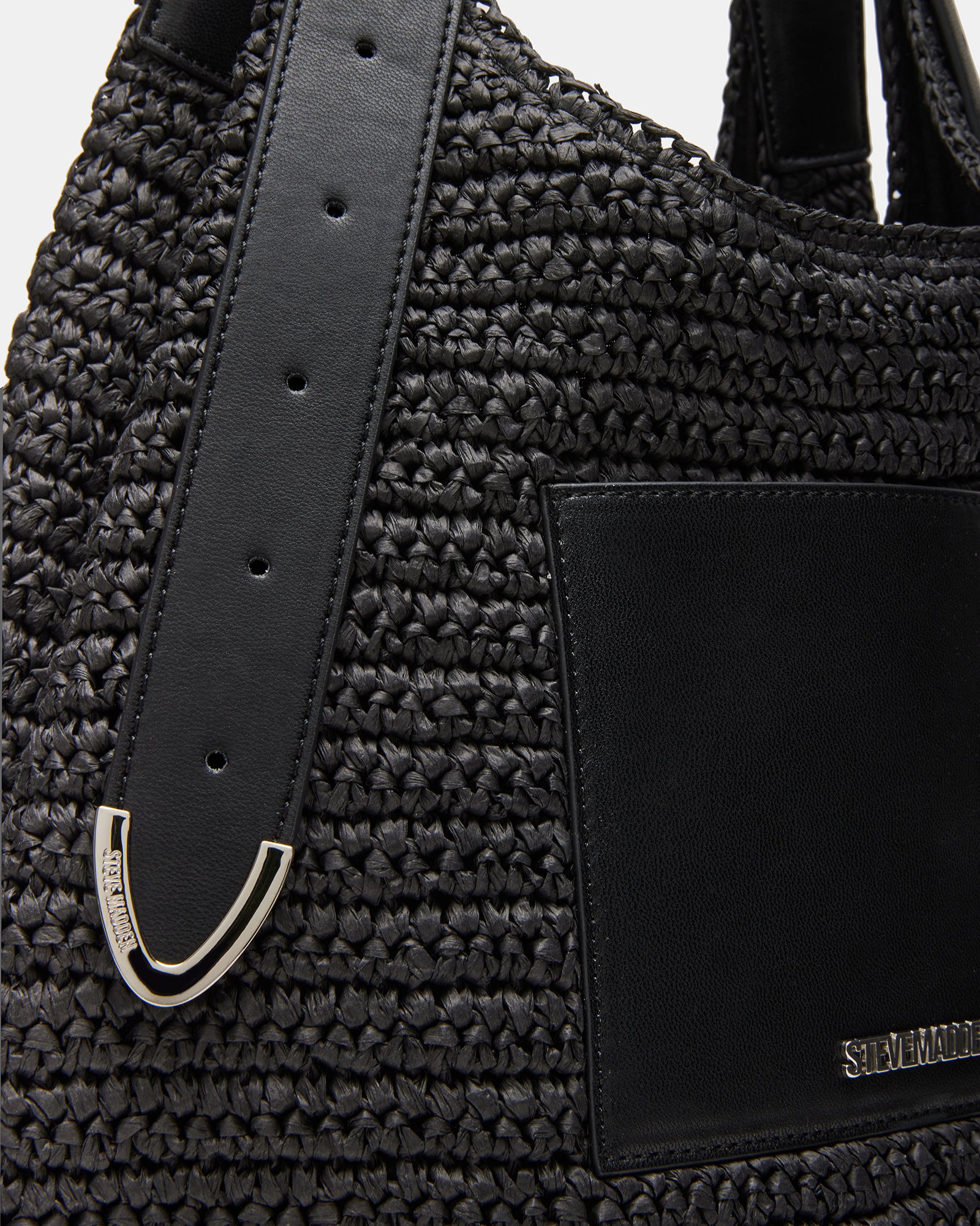 Side view of the suede hobo bag open to display interior compartments