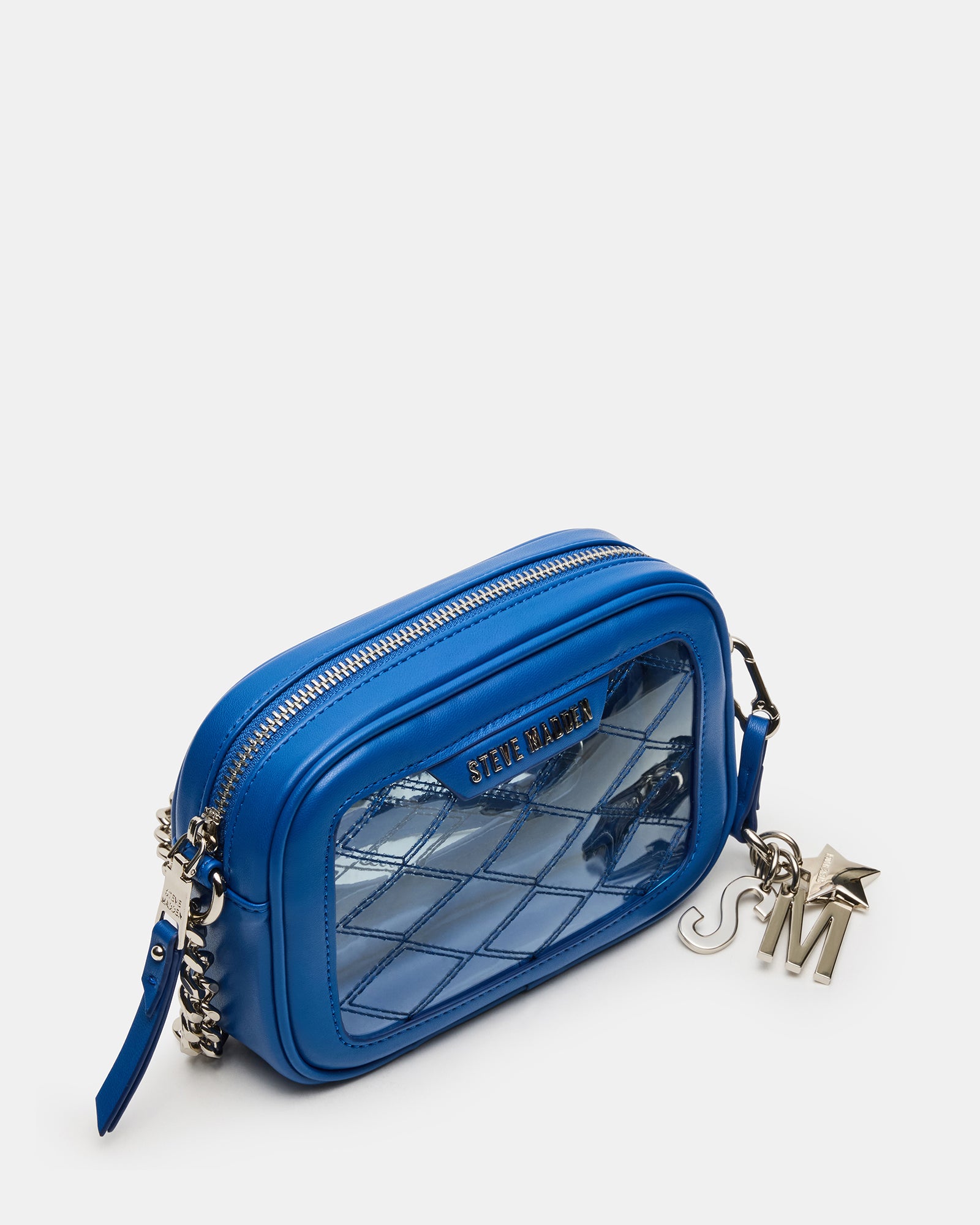 Close-up of blue jelly bag showing quilt stitching and matte hardware.