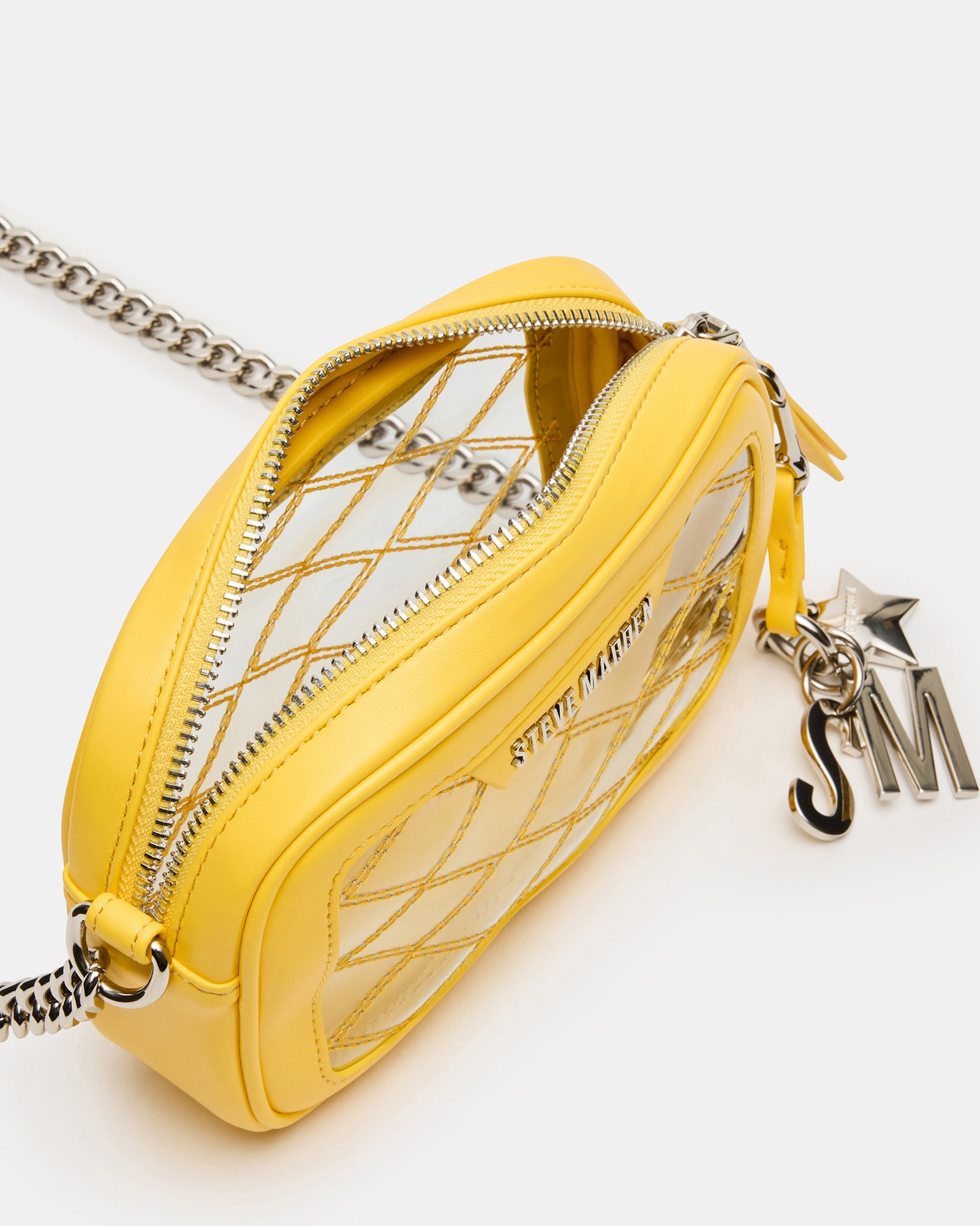 Close-up of the quilted texture and matte hardware on the clear crossbody bag.