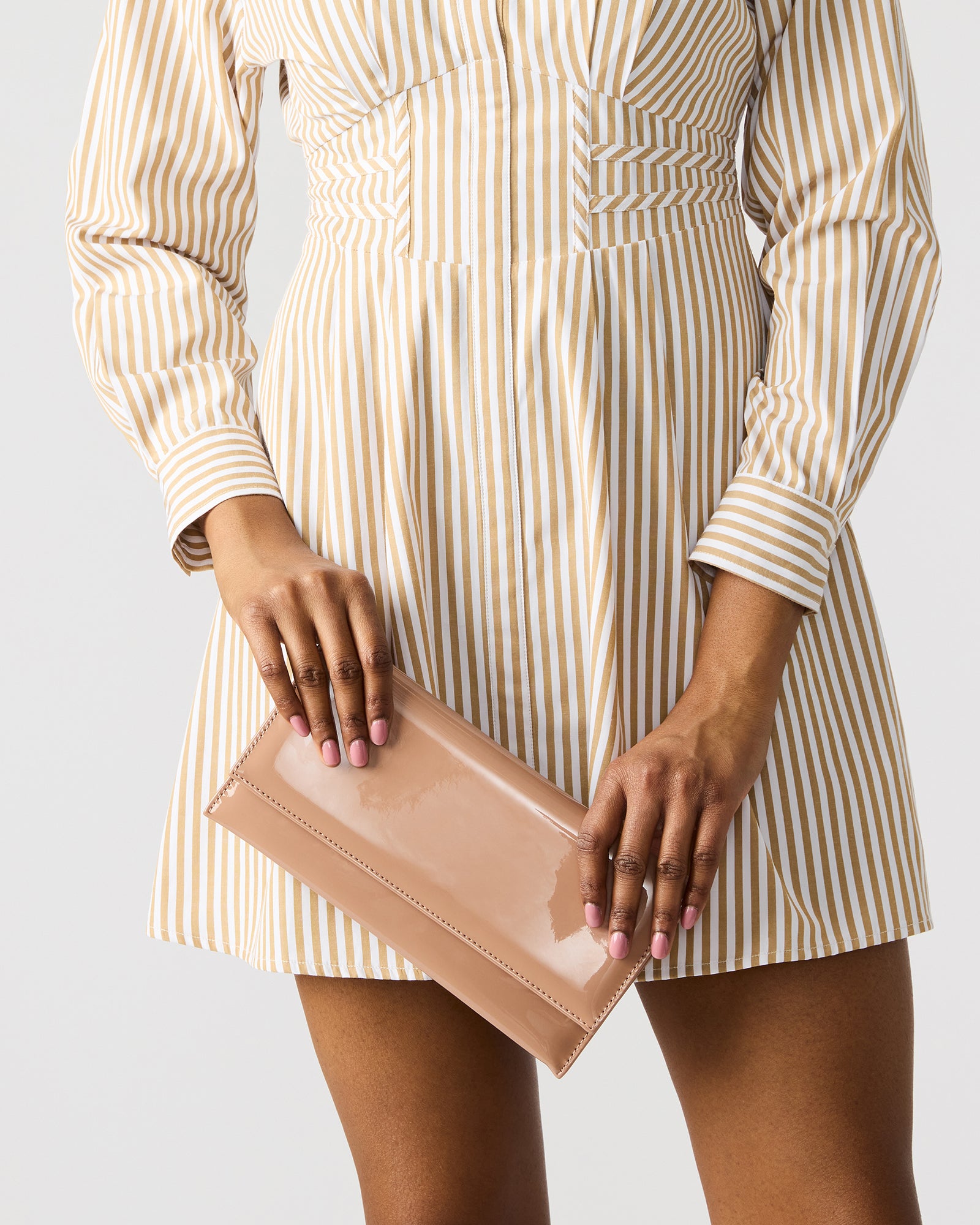 Juliana clutch bag worn crossbody with gold chain strap