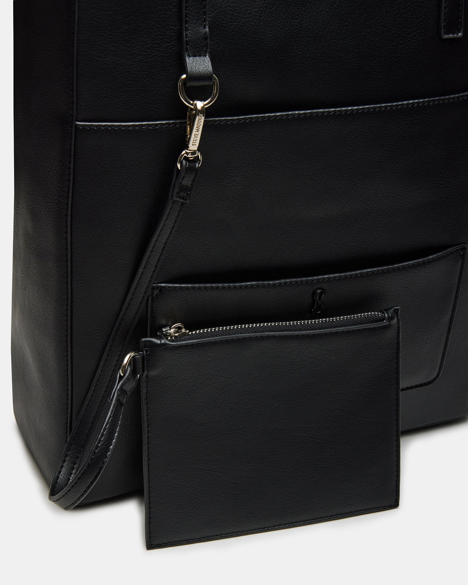 Interior angle showing compartments and patch pocket of black shoulder bag messenger bag.