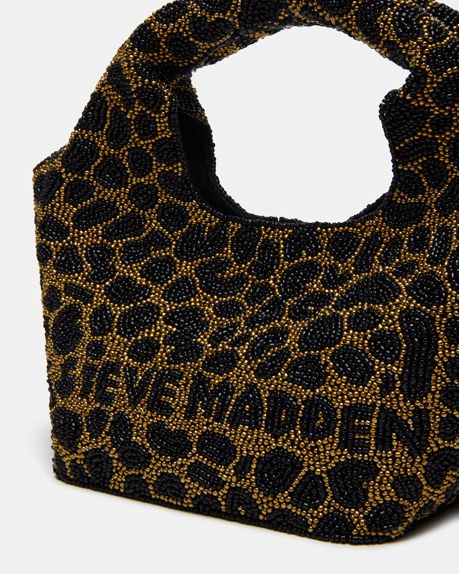 Side angle of the Kinsley beaded shoulder bag highlighting the tubular straps.