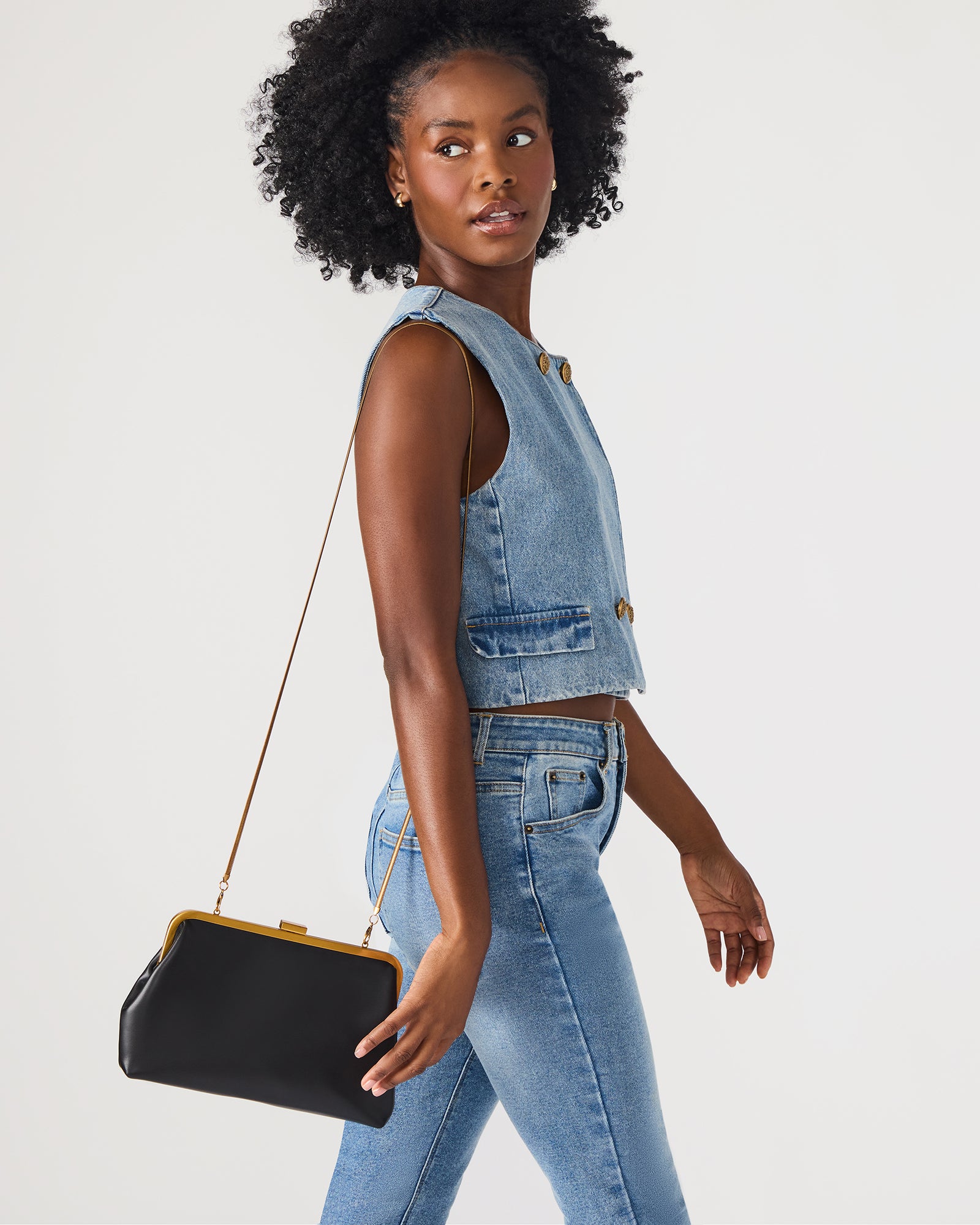 Velvet clutch bag shown with detachable chain for versatile styling