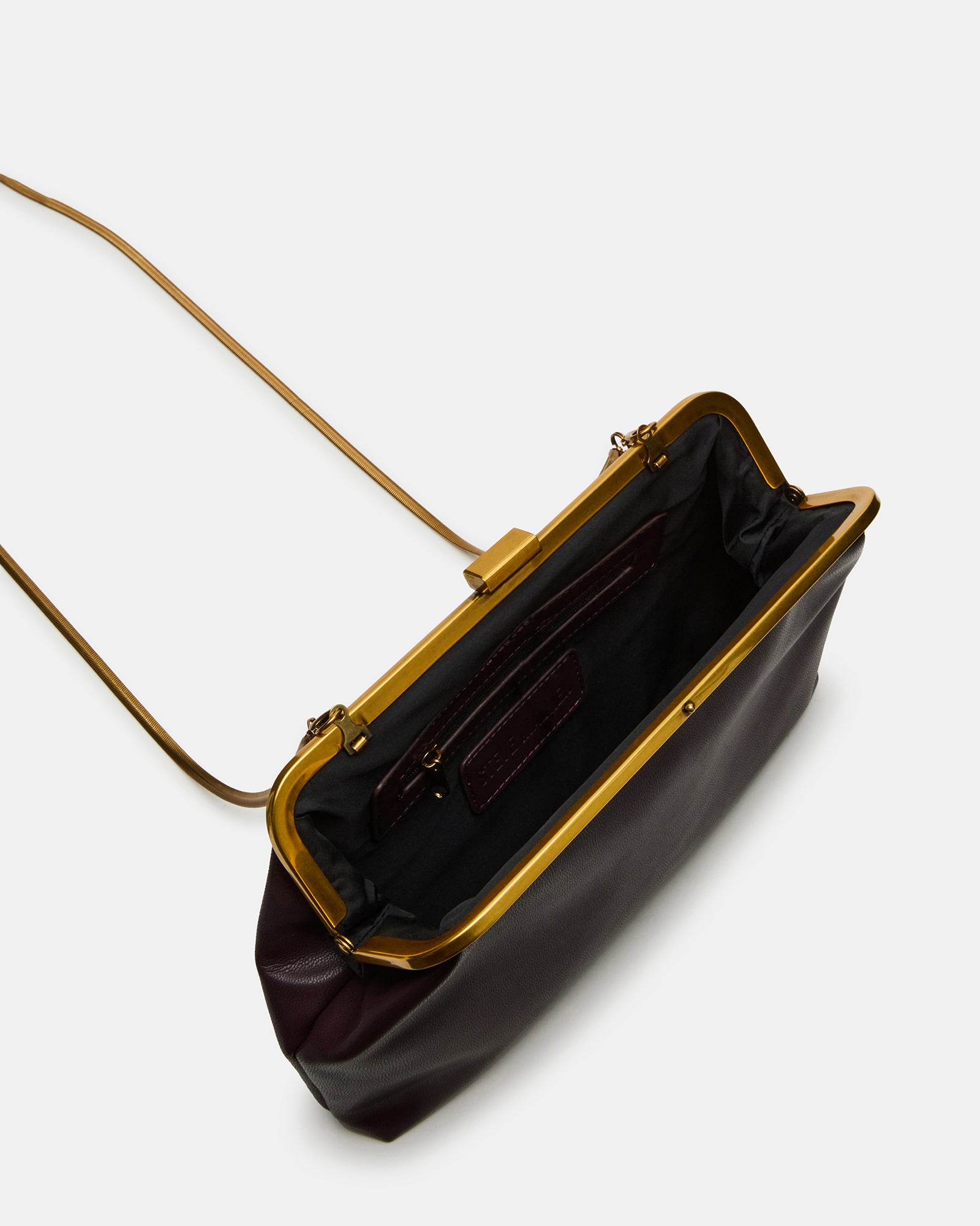 Overhead view of the black crossbody bag showing interior compartments and zipper pocket