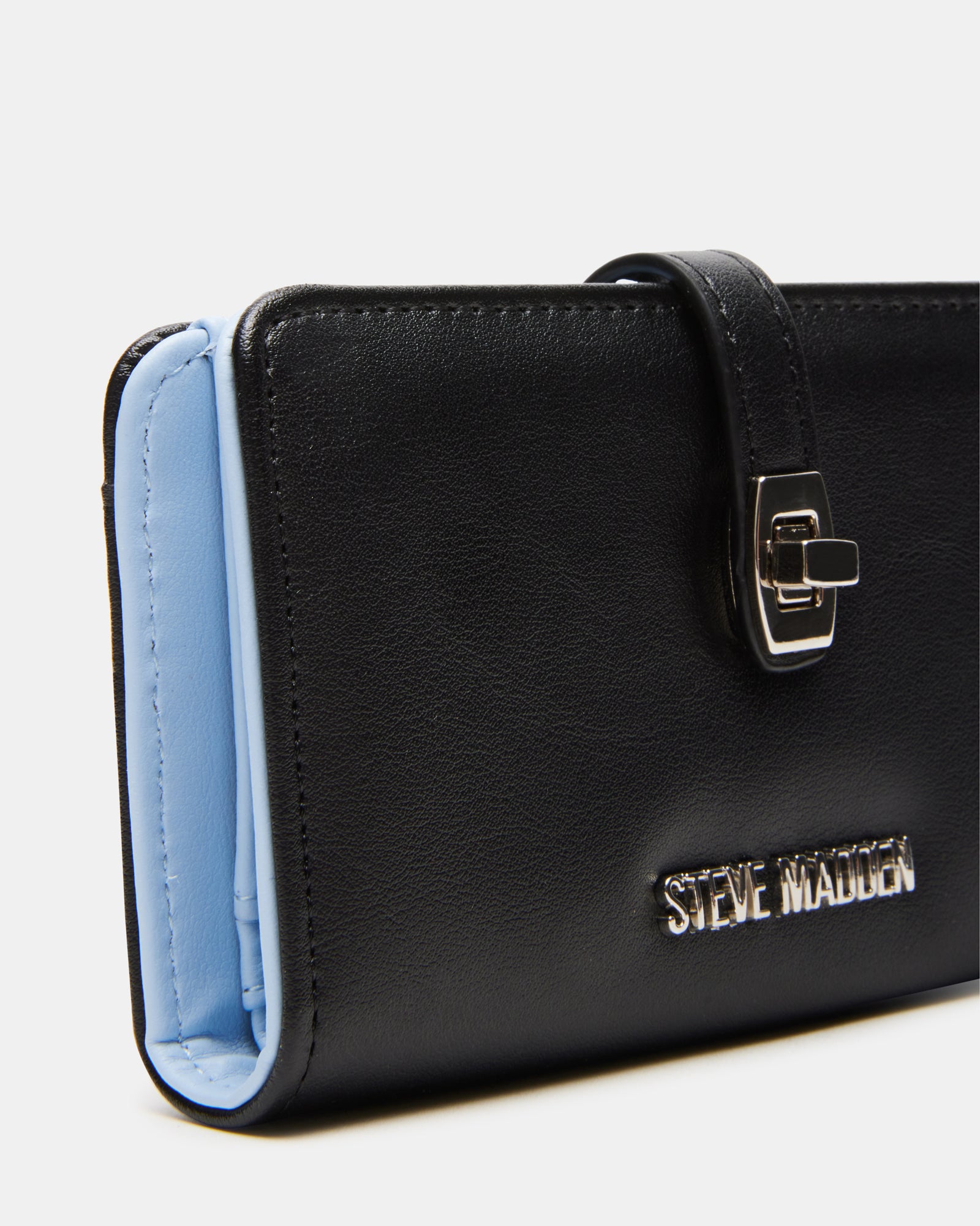 Close-up of turn-lock closure on designer wallet for men
