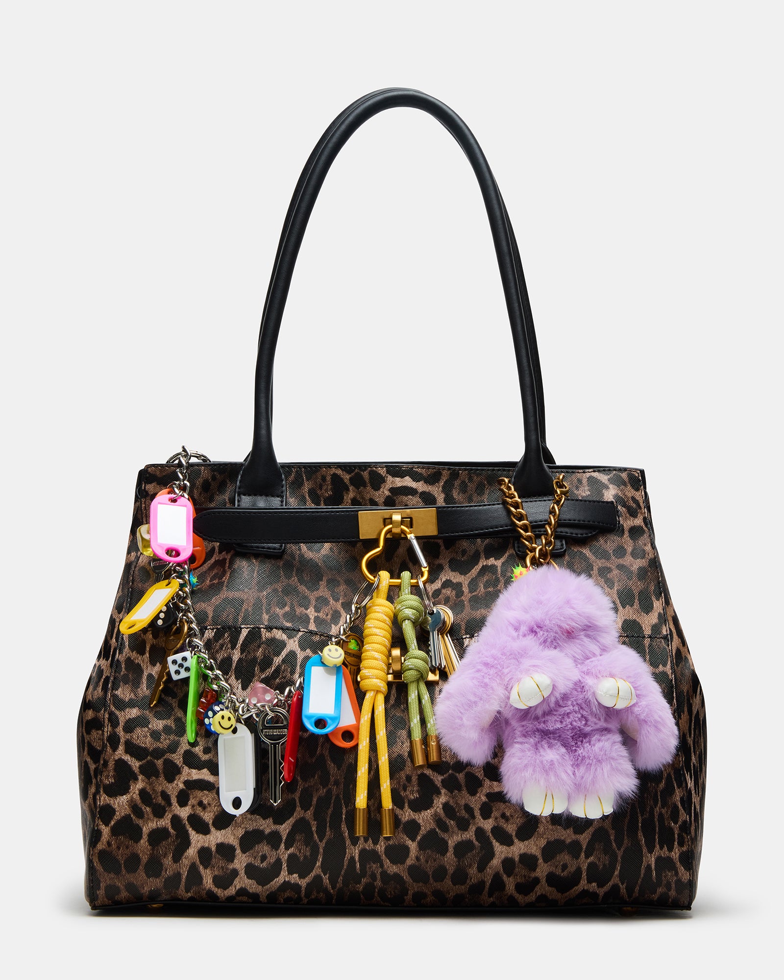 Leopard print handbag on a cafe table with accessories
