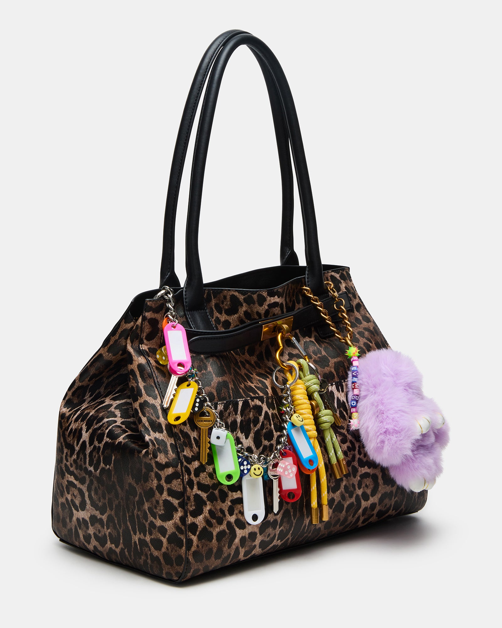Leopard print handbag on a cafe table with accessories