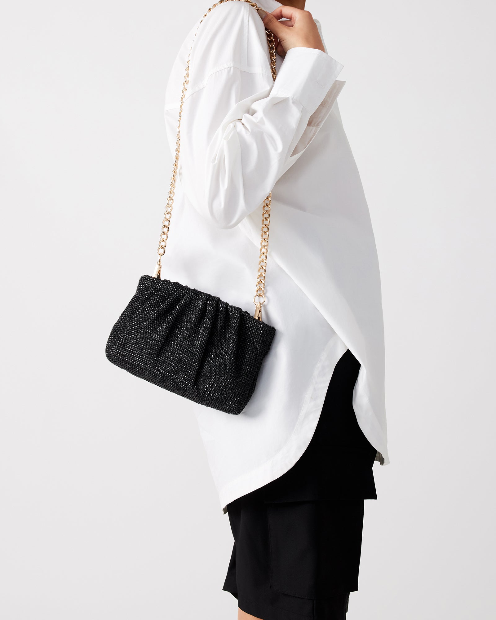 Close-up of the Lucia clutch bags zipper closure and interior pocket.