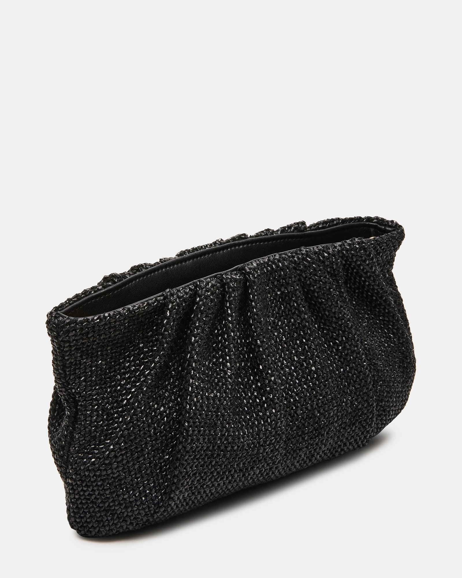 Lucia raffia clutch bag styled with a casual outfit for a chic look.