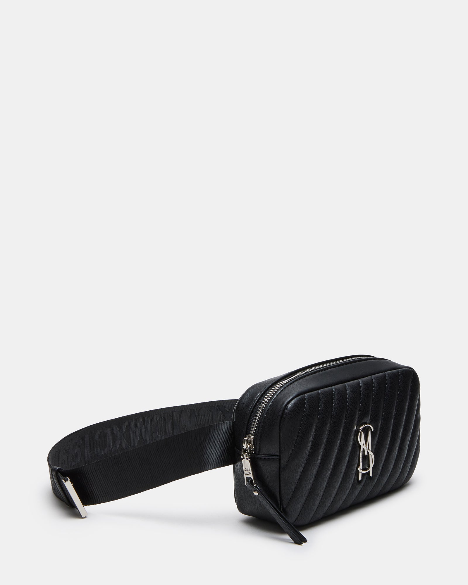 MACIEL black quilted bag styled crossbody with urban street background