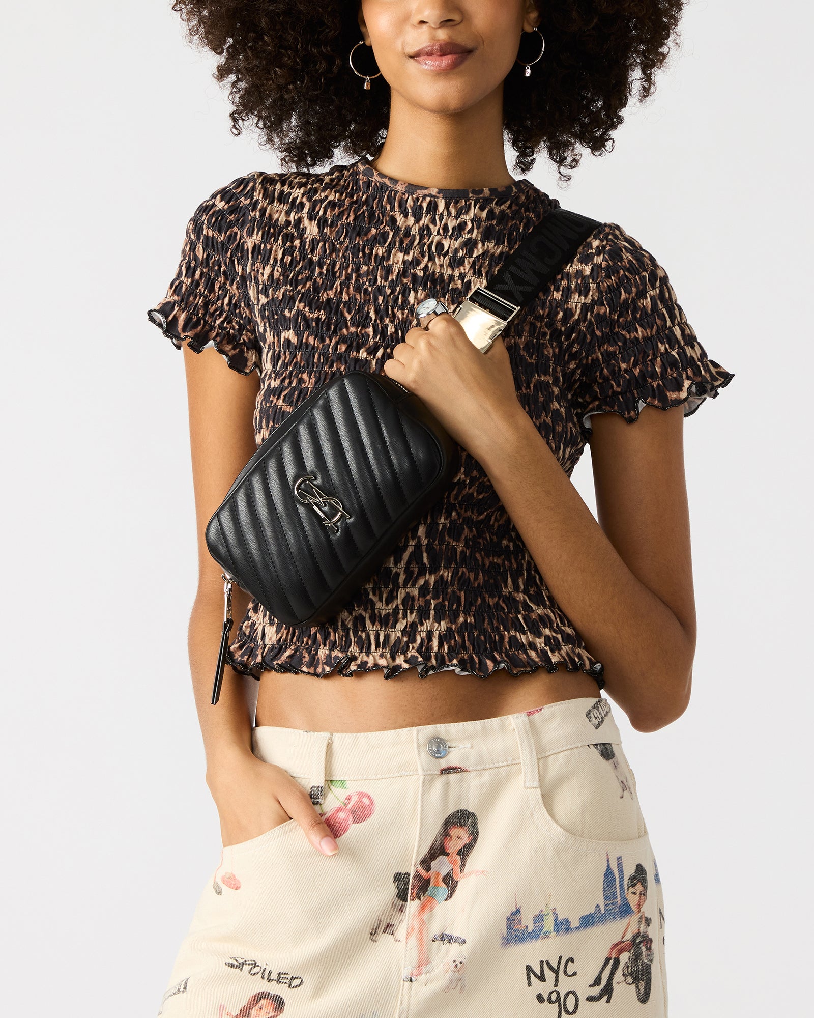 Close-up of quilted texture and metal zipper on belt bag