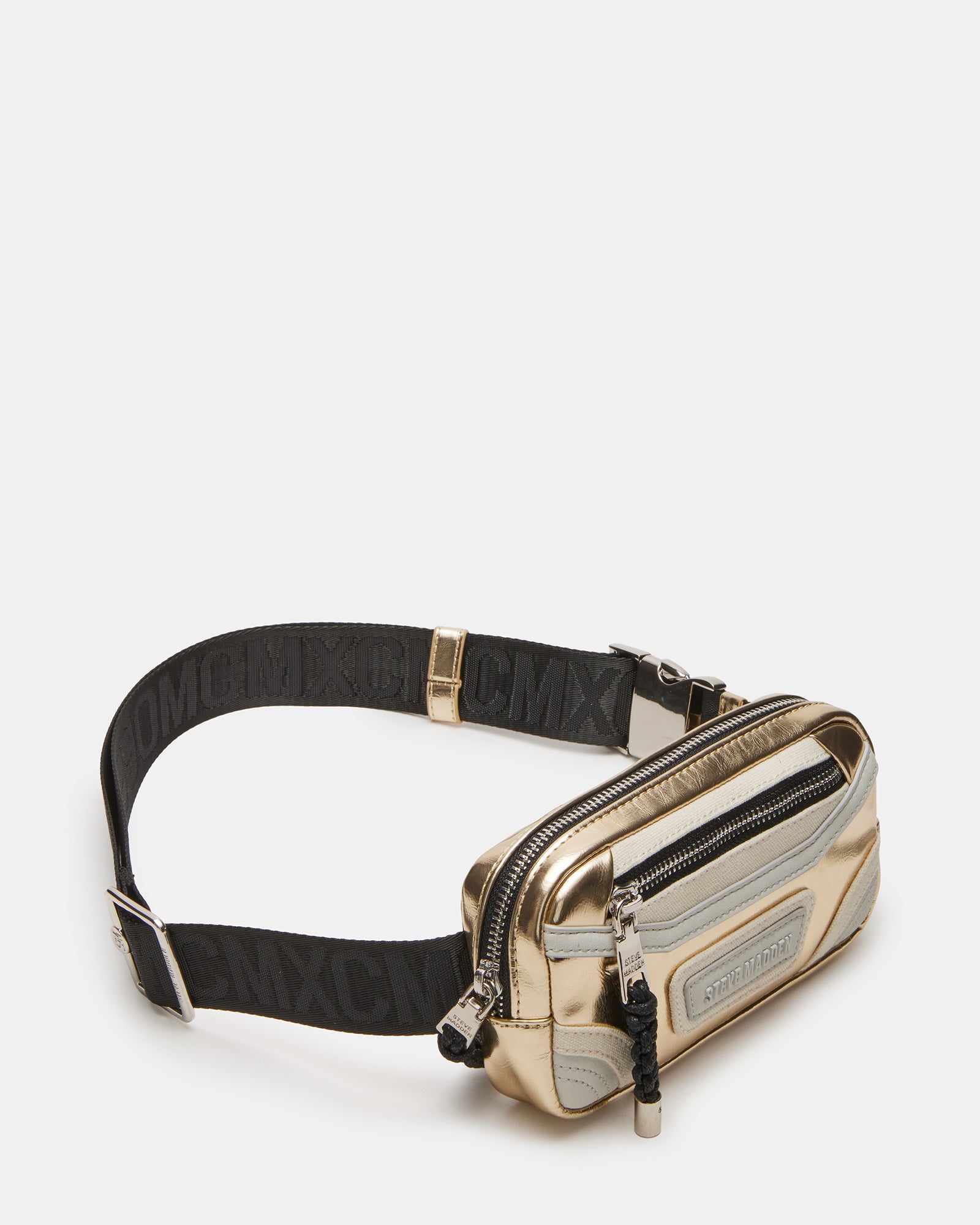 Close-up of gold belt bag showing front zipper and bungee detail