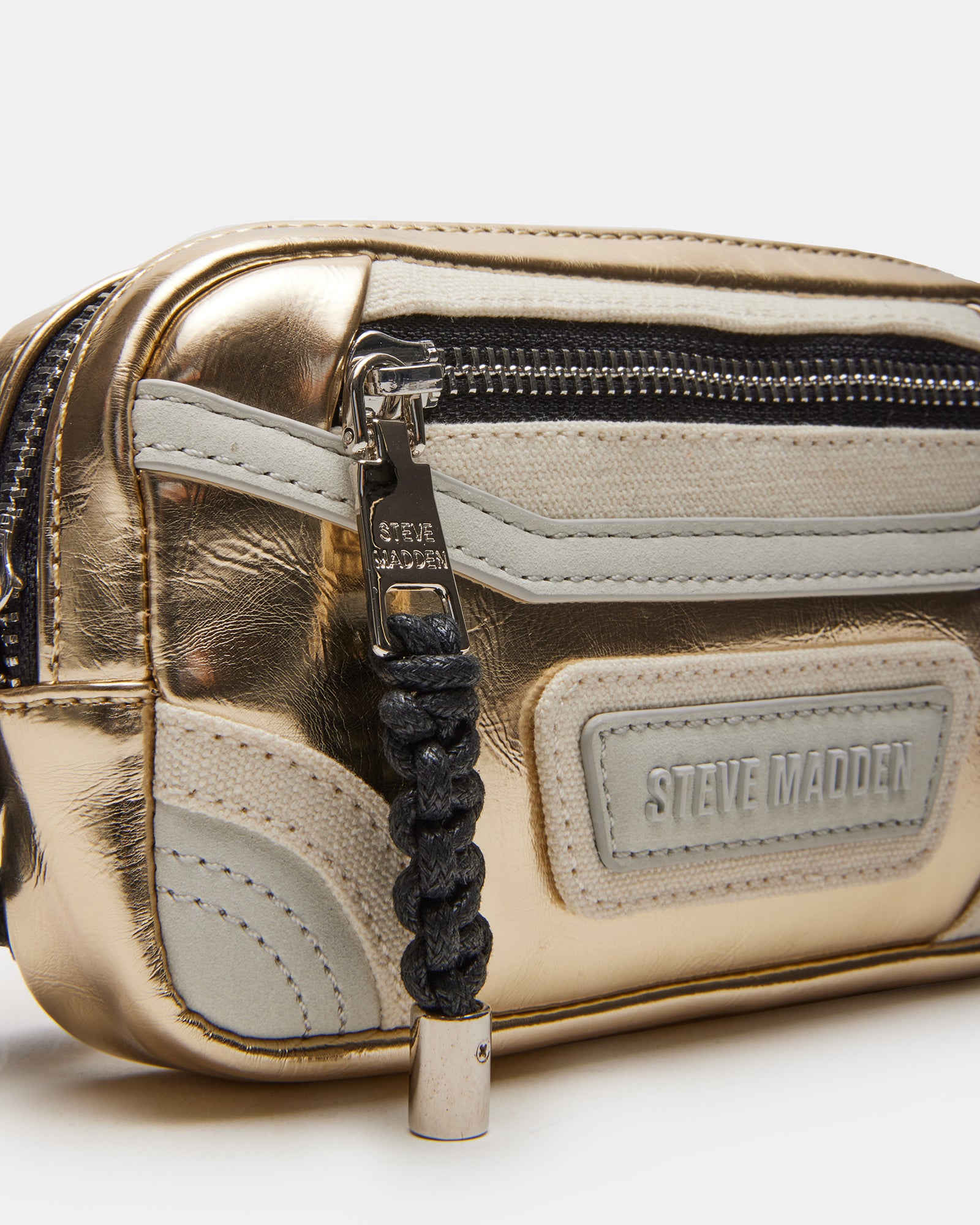 Top view of coach-style belt bag with leather texture and gold finish