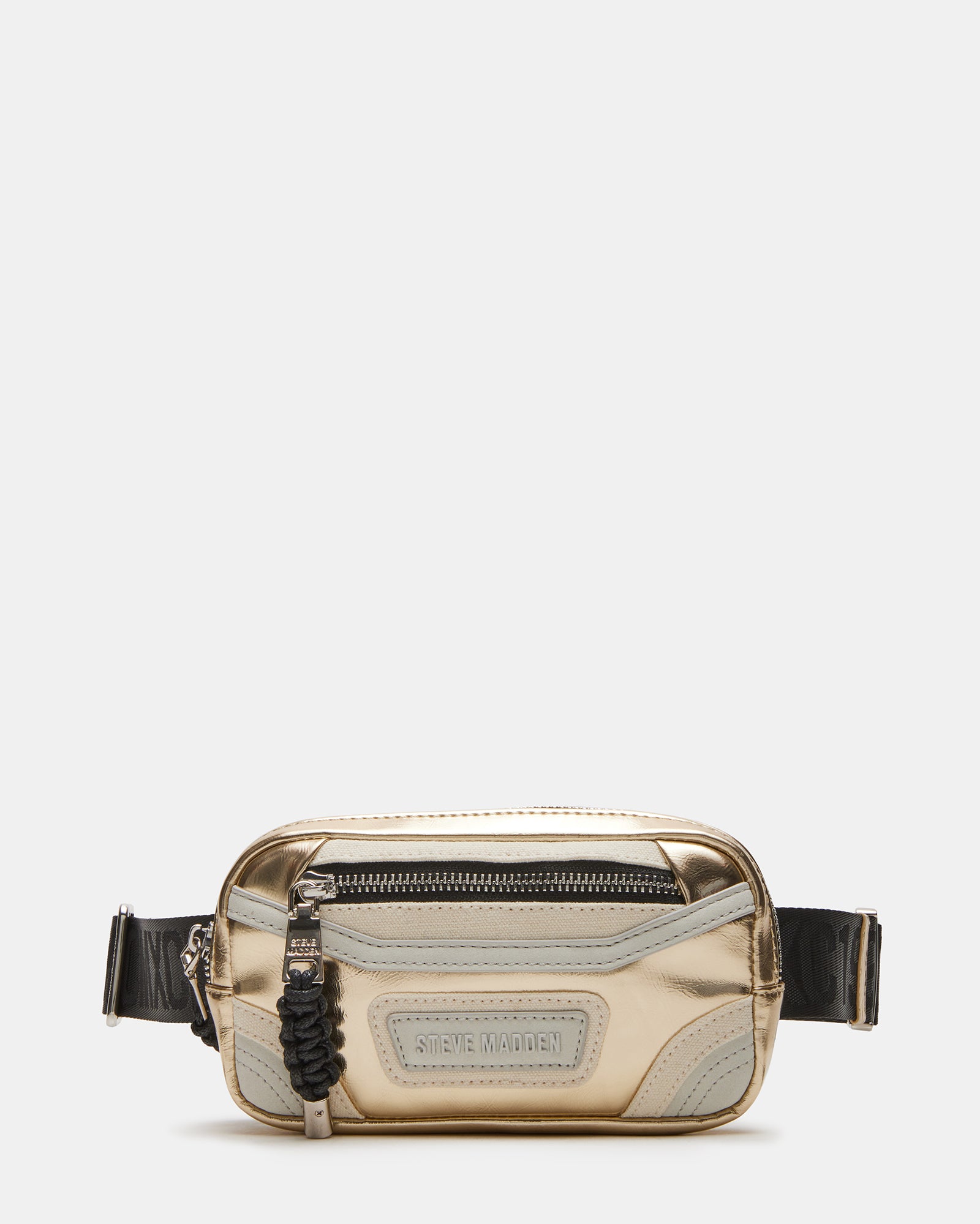 Close-up of gold belt bag showing front zipper and bungee detail